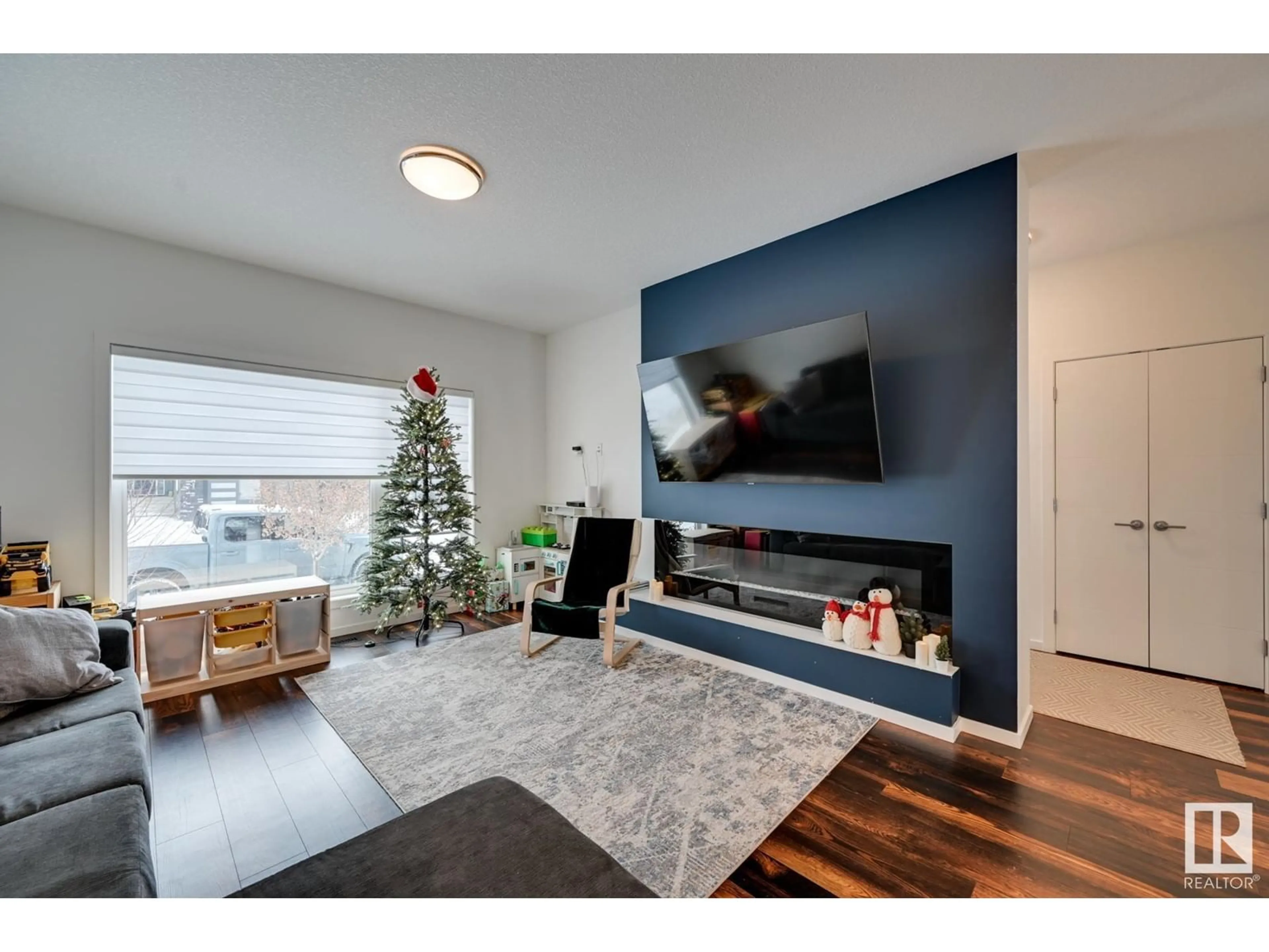 Living room with furniture, wood/laminate floor for 34 BRUNSWYCK CR, Spruce Grove Alberta T7X0Y9