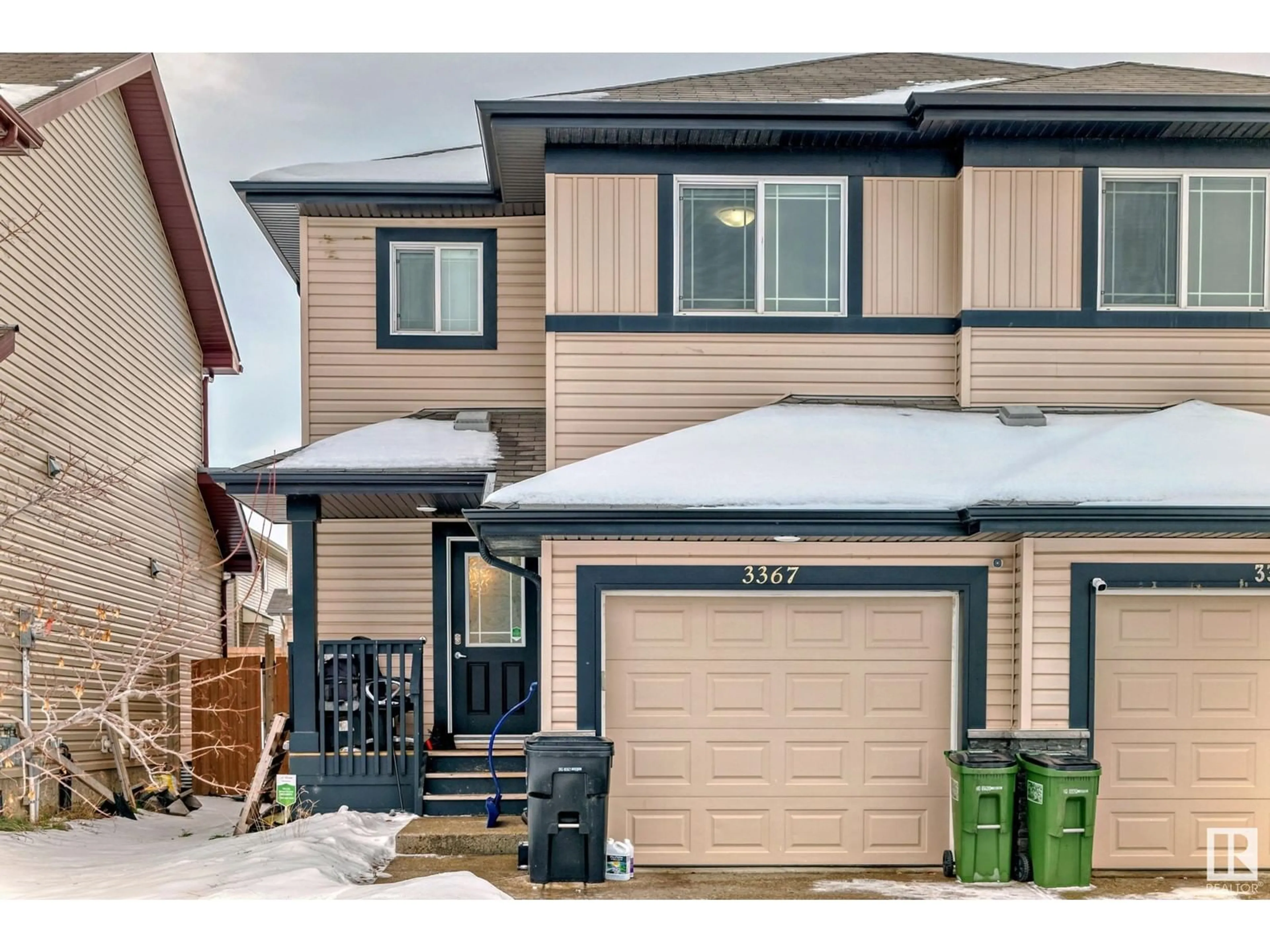 Home with vinyl exterior material, street for 3367 14 AVE NW, Edmonton Alberta T6T0X3