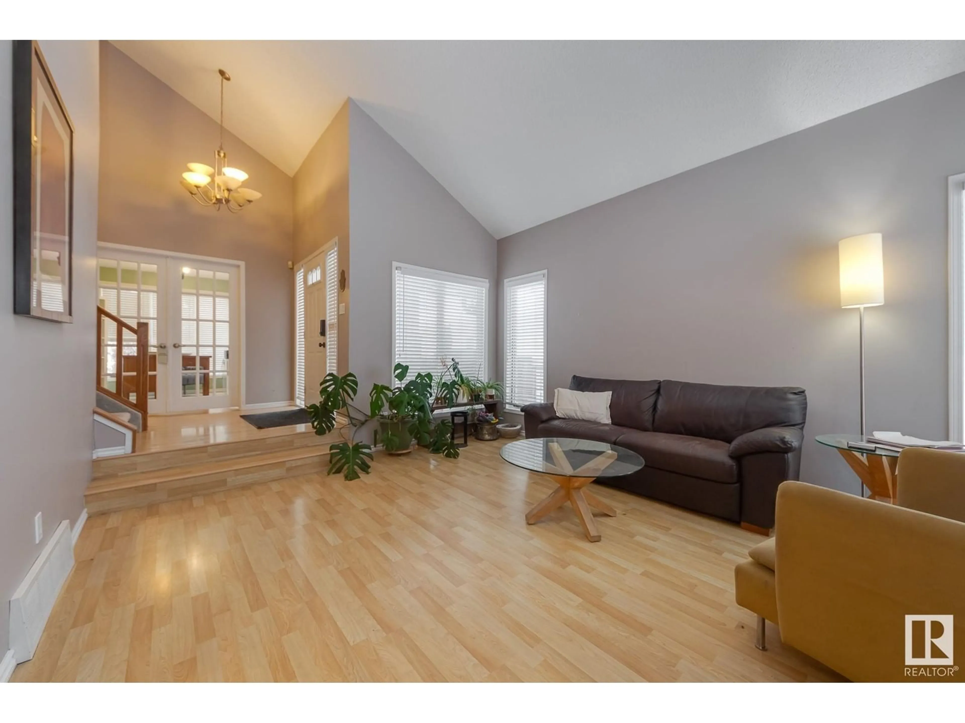 Living room with furniture, wood/laminate floor for 17816 57 AV NW, Edmonton Alberta T6M1S5