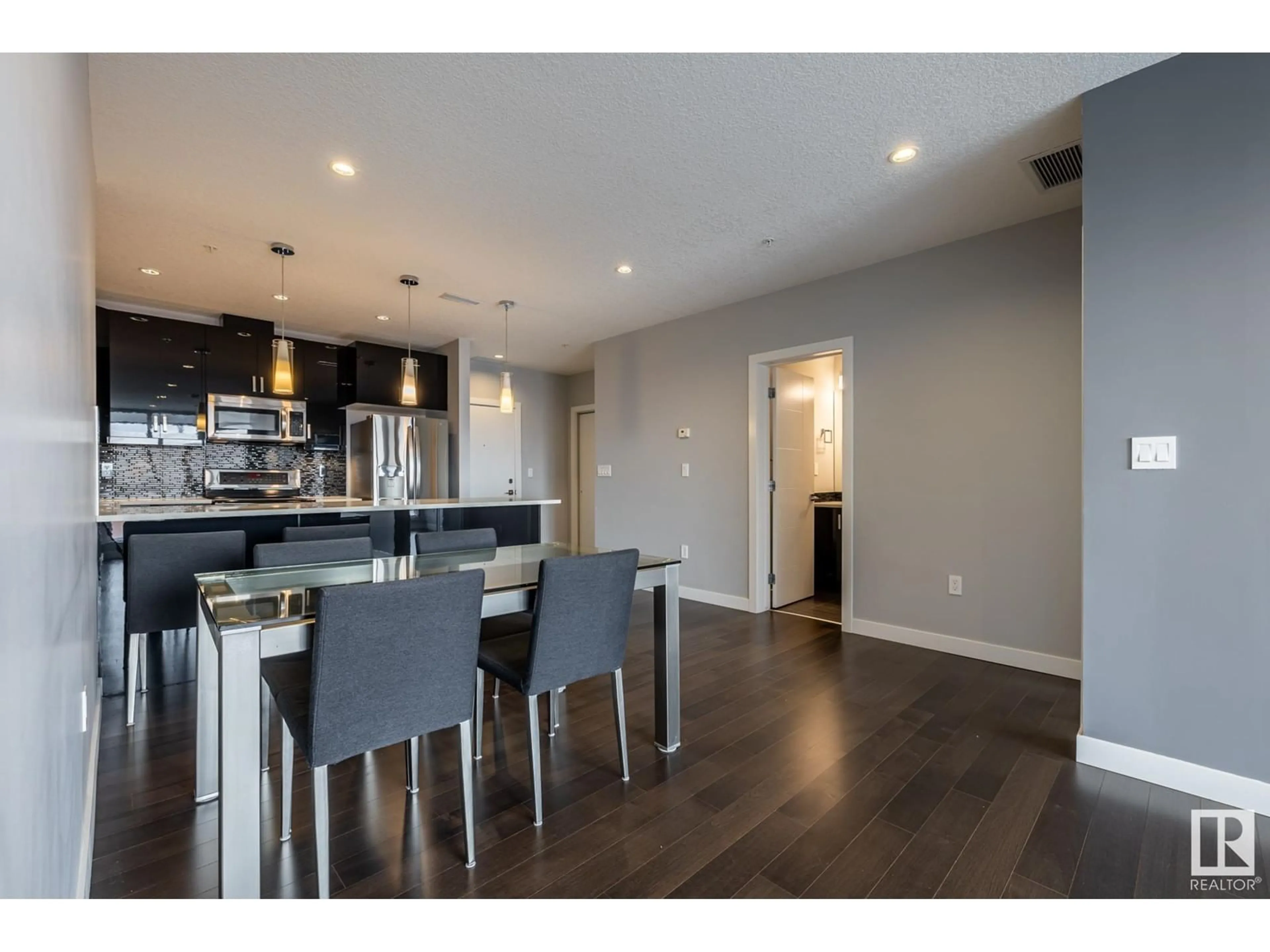 Open concept kitchen, wood/laminate floor for #705 10238 103 ST NW, Edmonton Alberta T5J0Y8