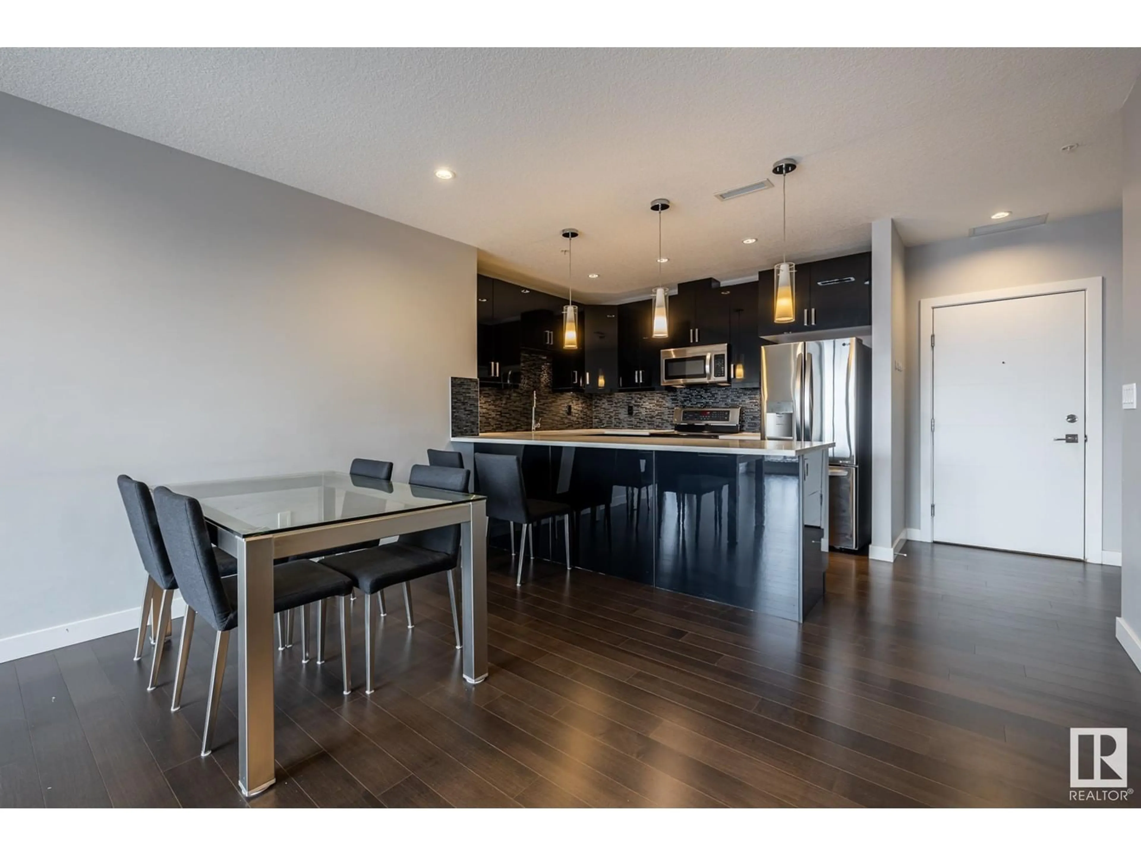 Open concept kitchen, wood/laminate floor for #705 10238 103 ST NW, Edmonton Alberta T5J0Y8