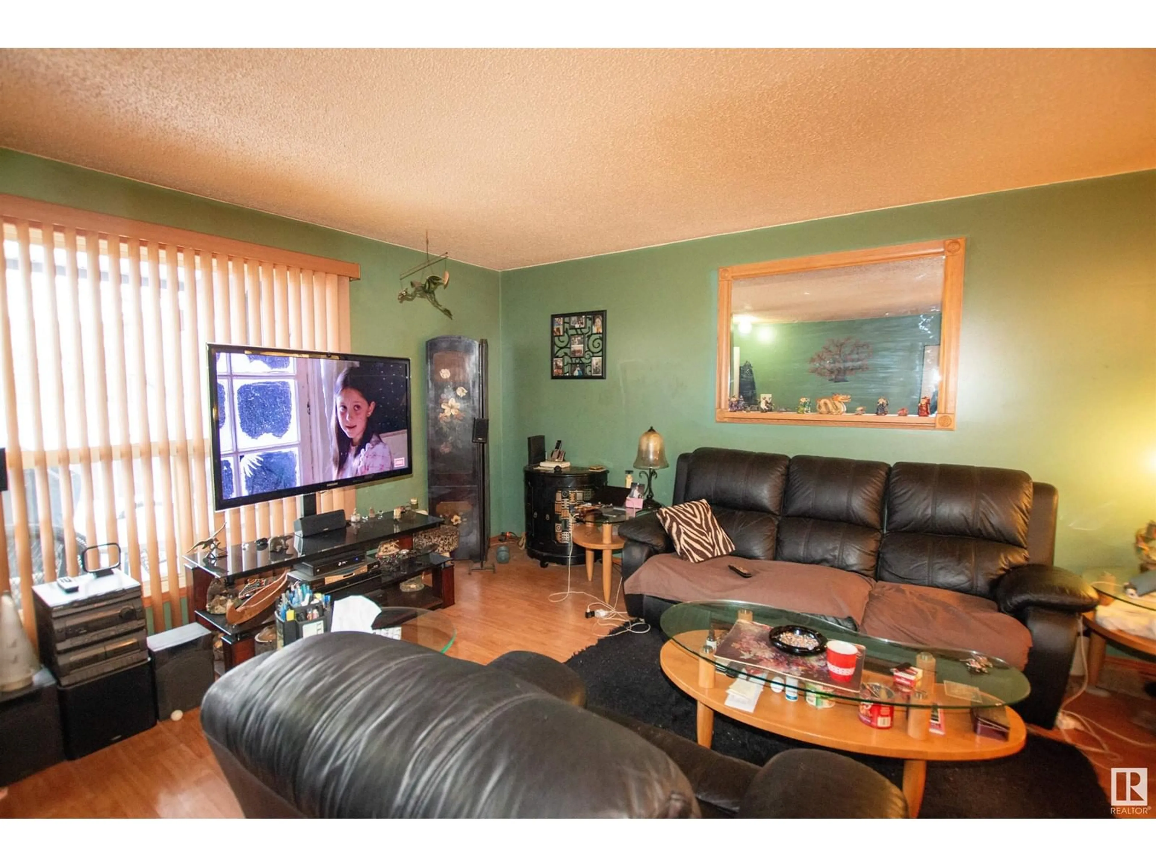 Living room with furniture, wood/laminate floor for 9251 172 ST NW, Edmonton Alberta T5T3G2