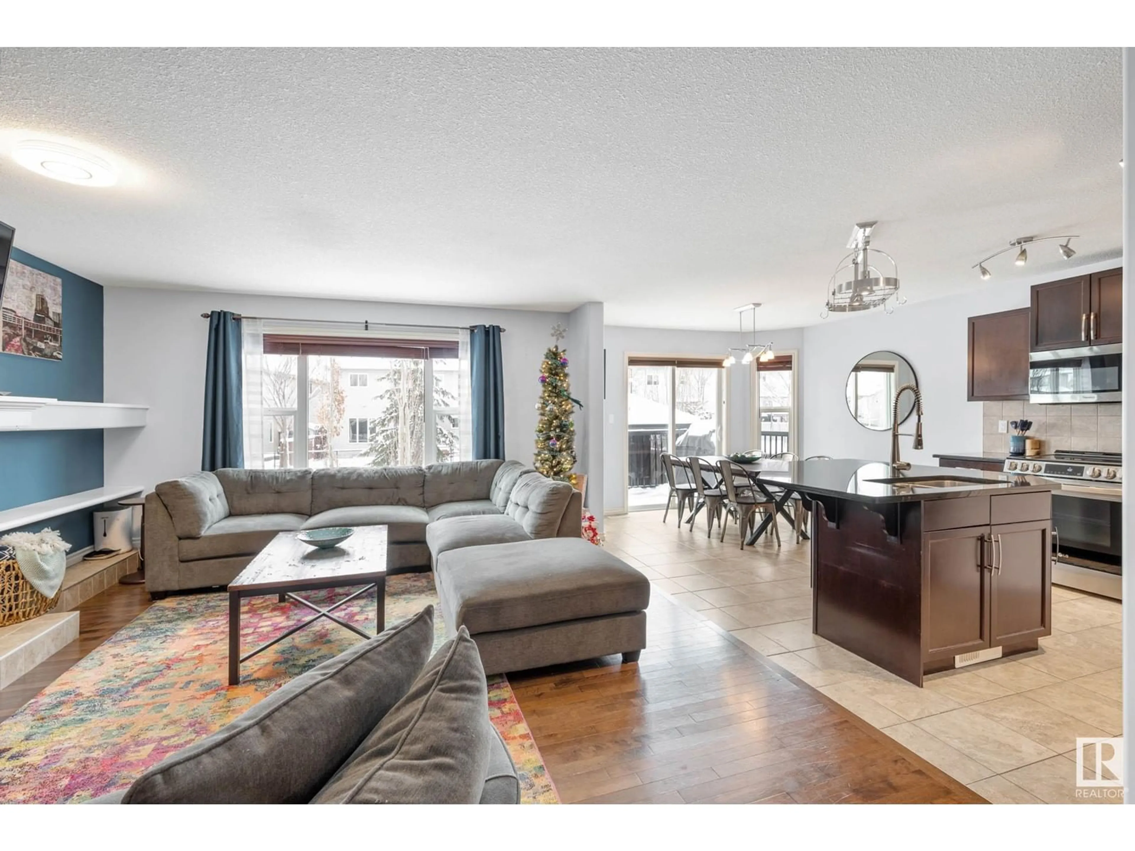 Living room with furniture, wood/laminate floor for 1409 37A AV NW, Edmonton Alberta T6T0H9