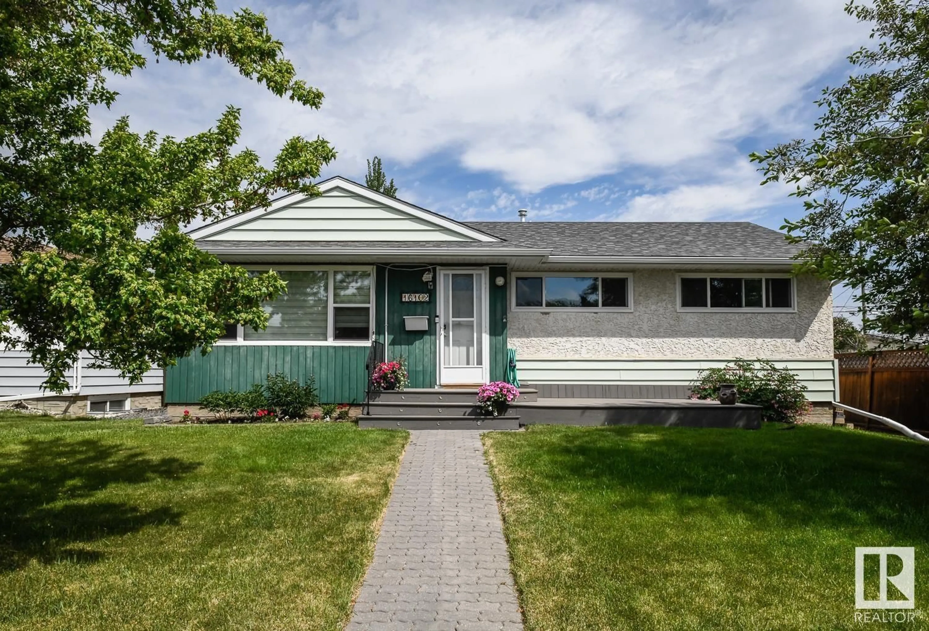 Home with vinyl exterior material, street for 16102 107A AV NW, Edmonton Alberta T5P4E1