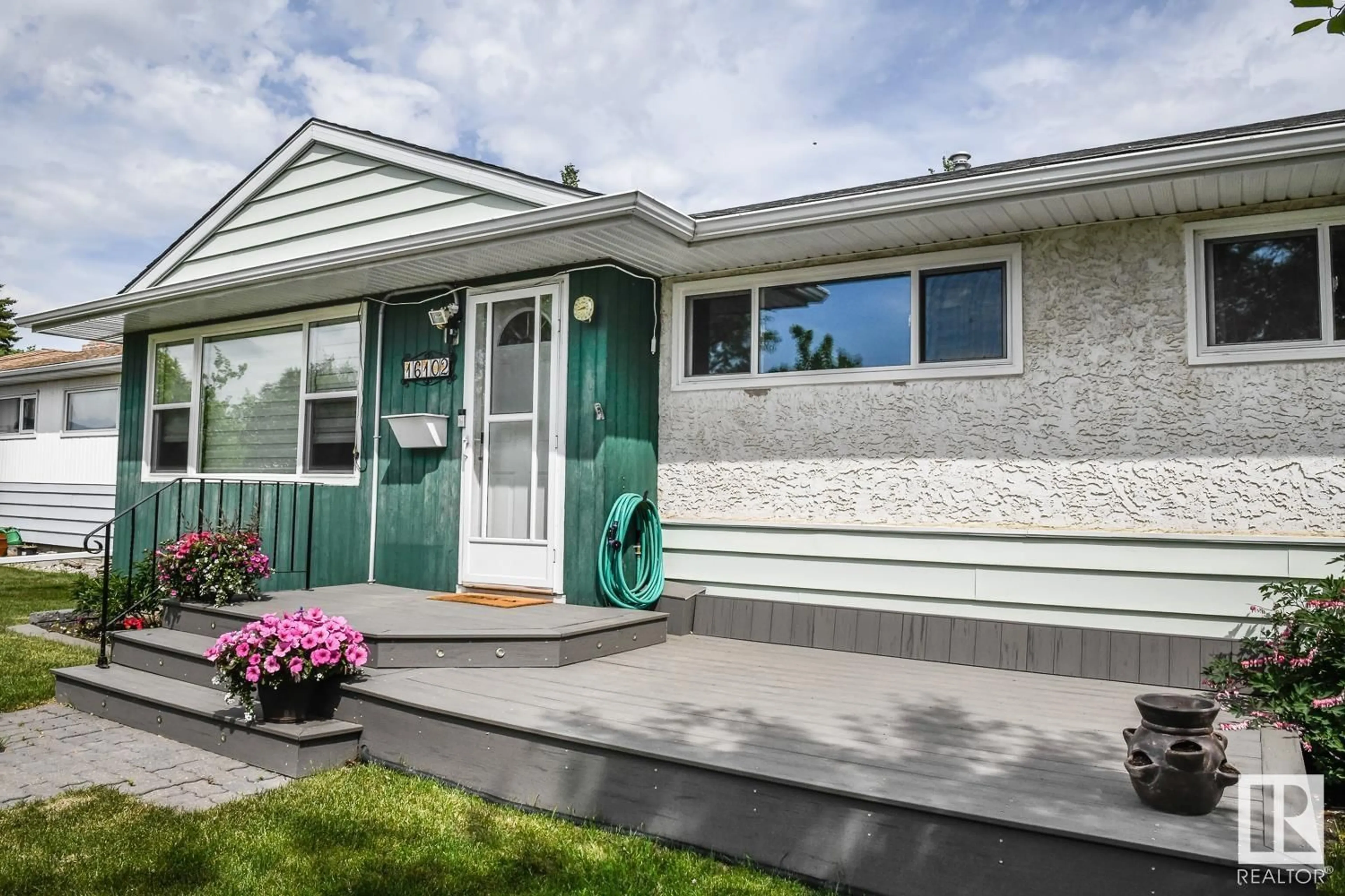 Home with vinyl exterior material, street for 16102 107A AV NW, Edmonton Alberta T5P4E1