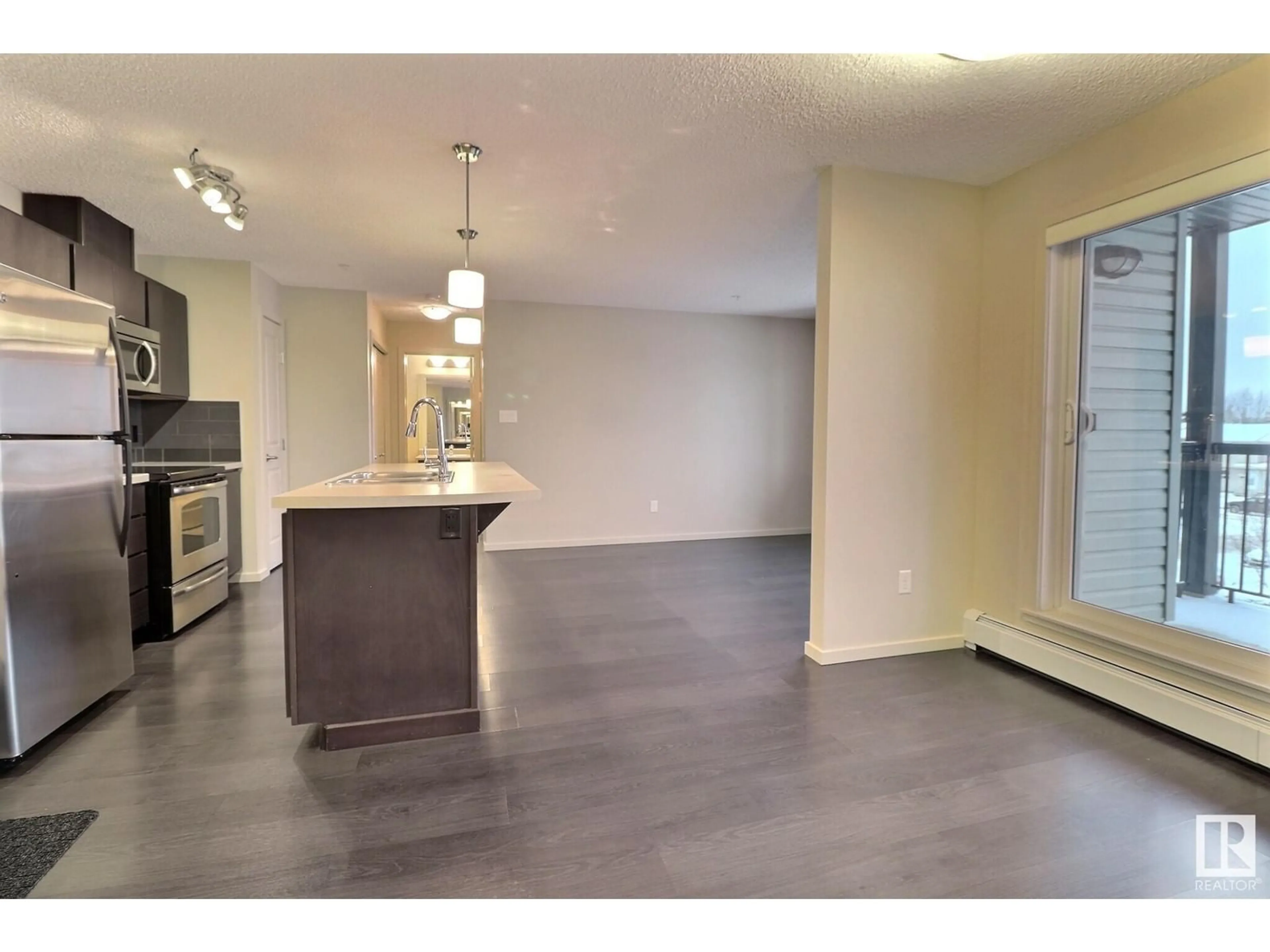 Open concept kitchen, unknown for #347 1196 HYNDMAN RD NW, Edmonton Alberta T5W0A2