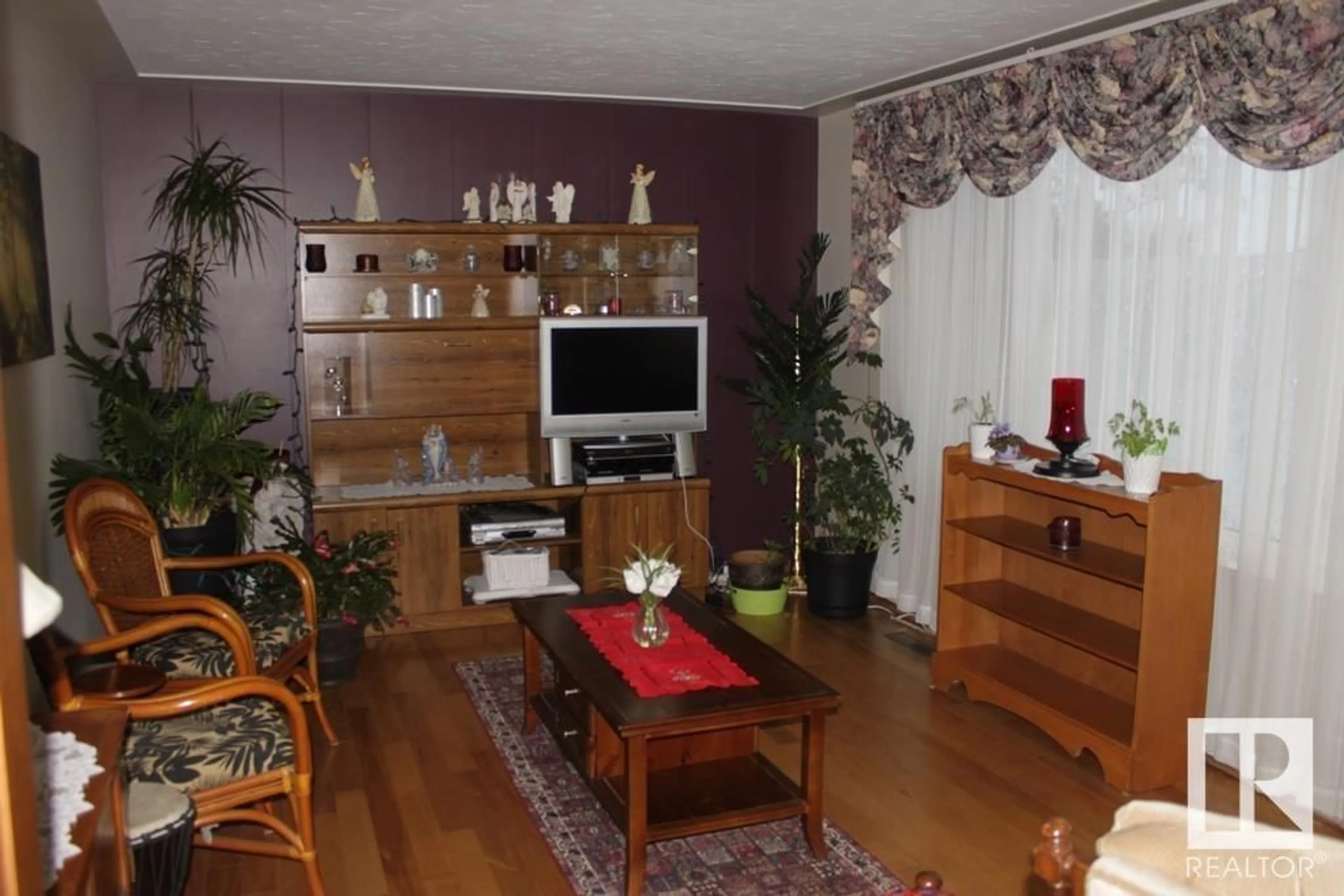 Living room with furniture, wood/laminate floor for 5218 52 AV, Mundare Alberta T0B3H0