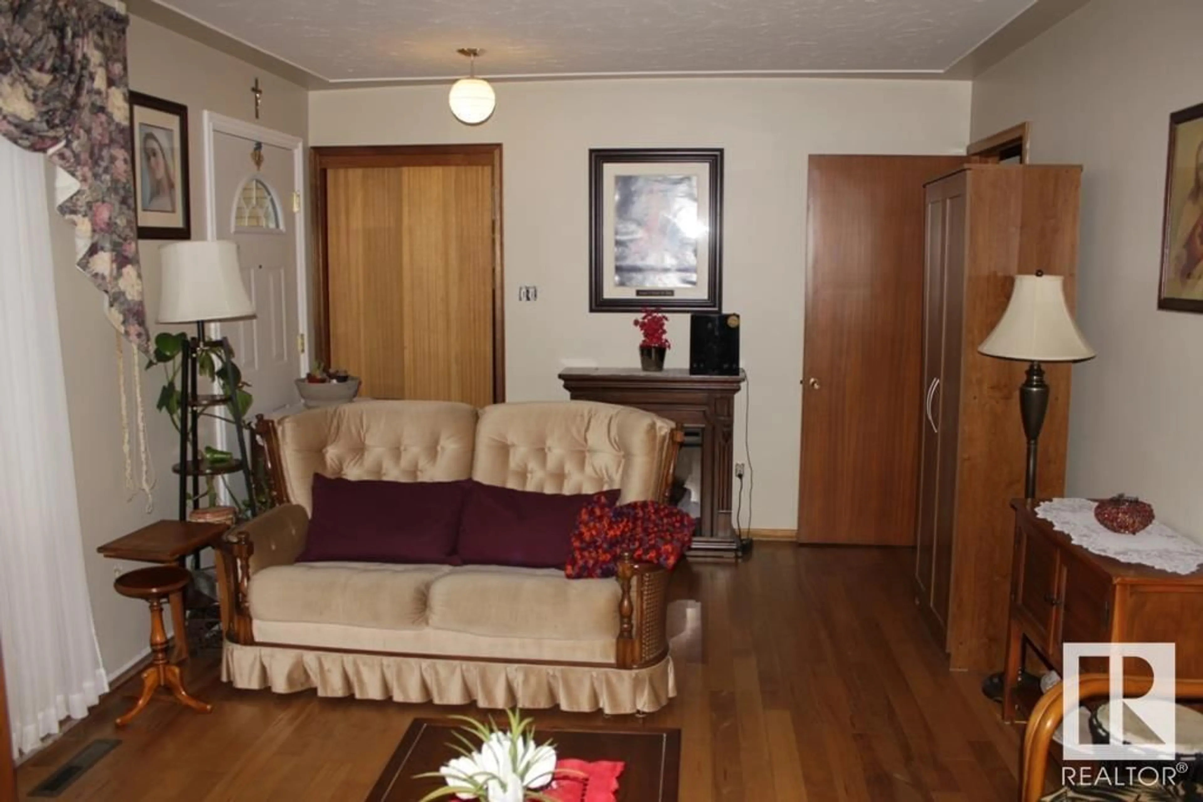 Living room with furniture, wood/laminate floor for 5218 52 AV, Mundare Alberta T0B3H0