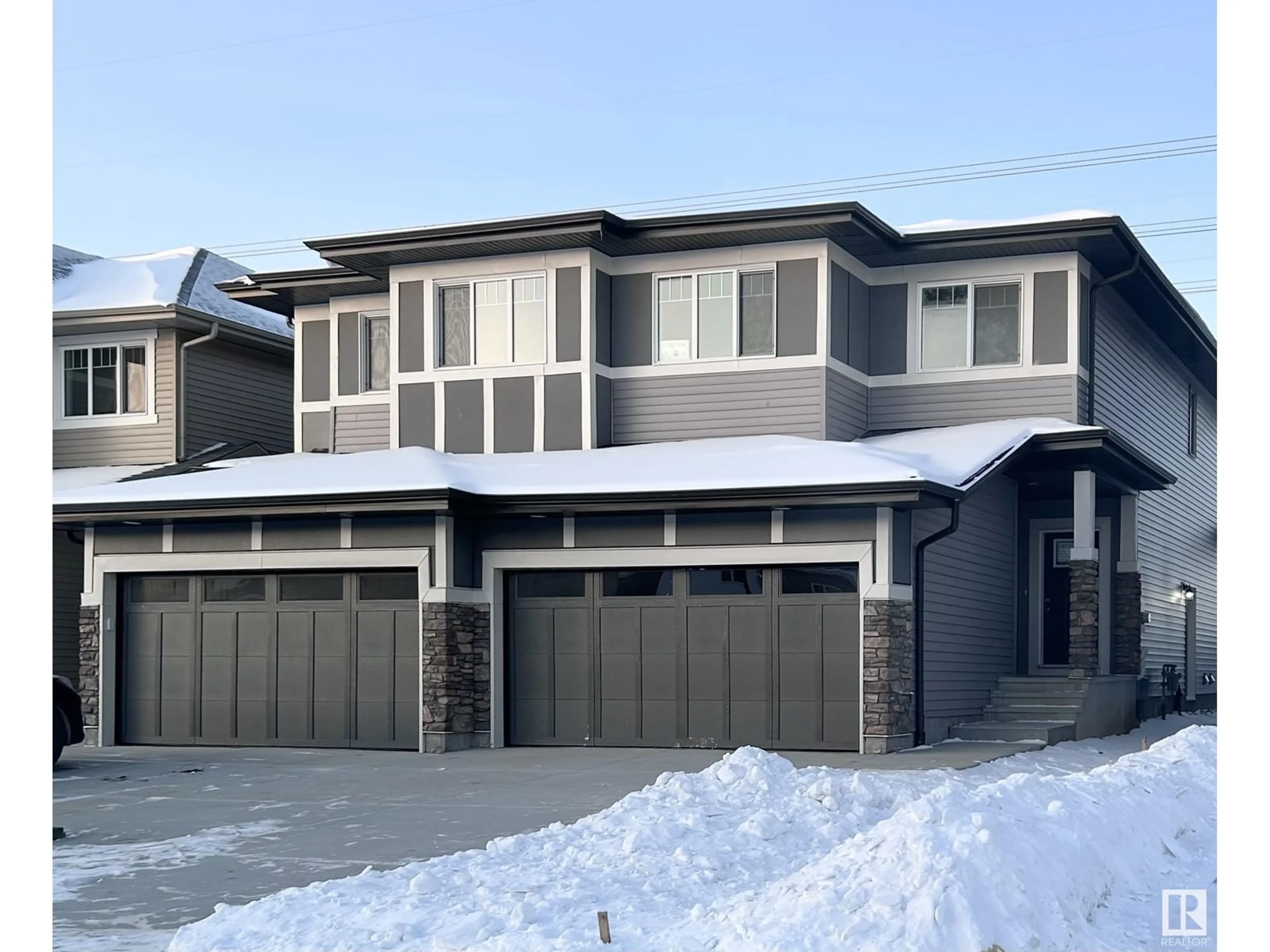 Home with vinyl exterior material, street for 19720 29 AV NW NW, Edmonton Alberta T6M1M2