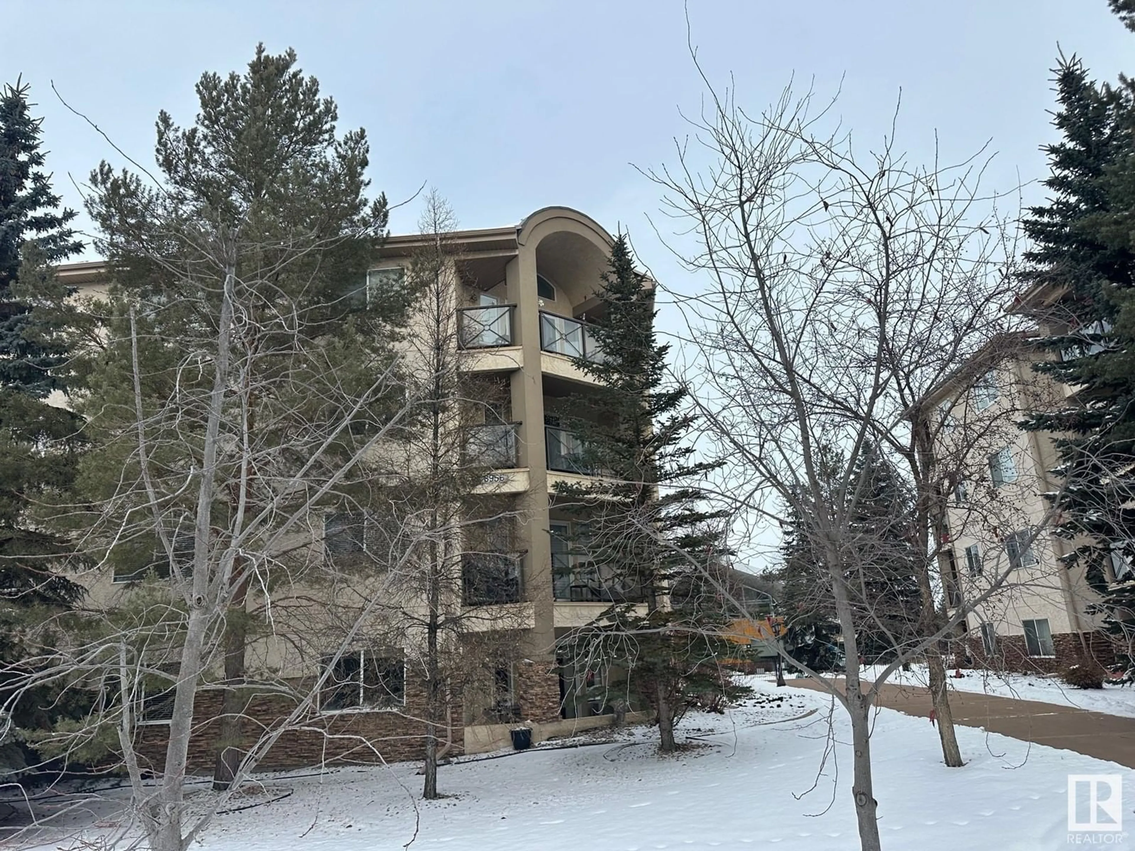 A pic from outside/outdoor area/front of a property/back of a property/a pic from drone, mountain view for #303 8956 156 ST NW, Edmonton Alberta T5R5X6