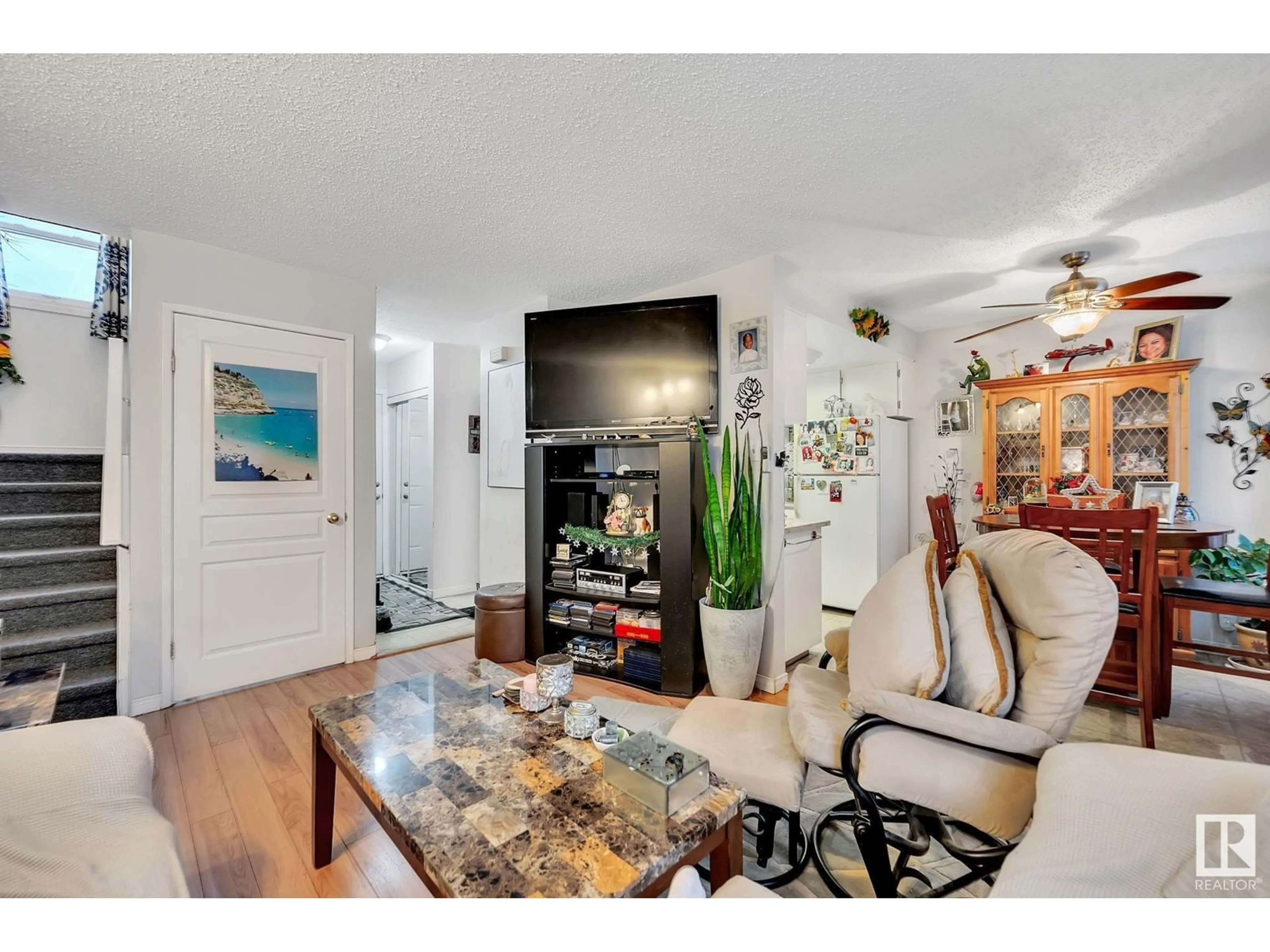 Living room with furniture, wood/laminate floor for 464 ABBOTTSFIELD RD NW, Edmonton Alberta T5W4R3