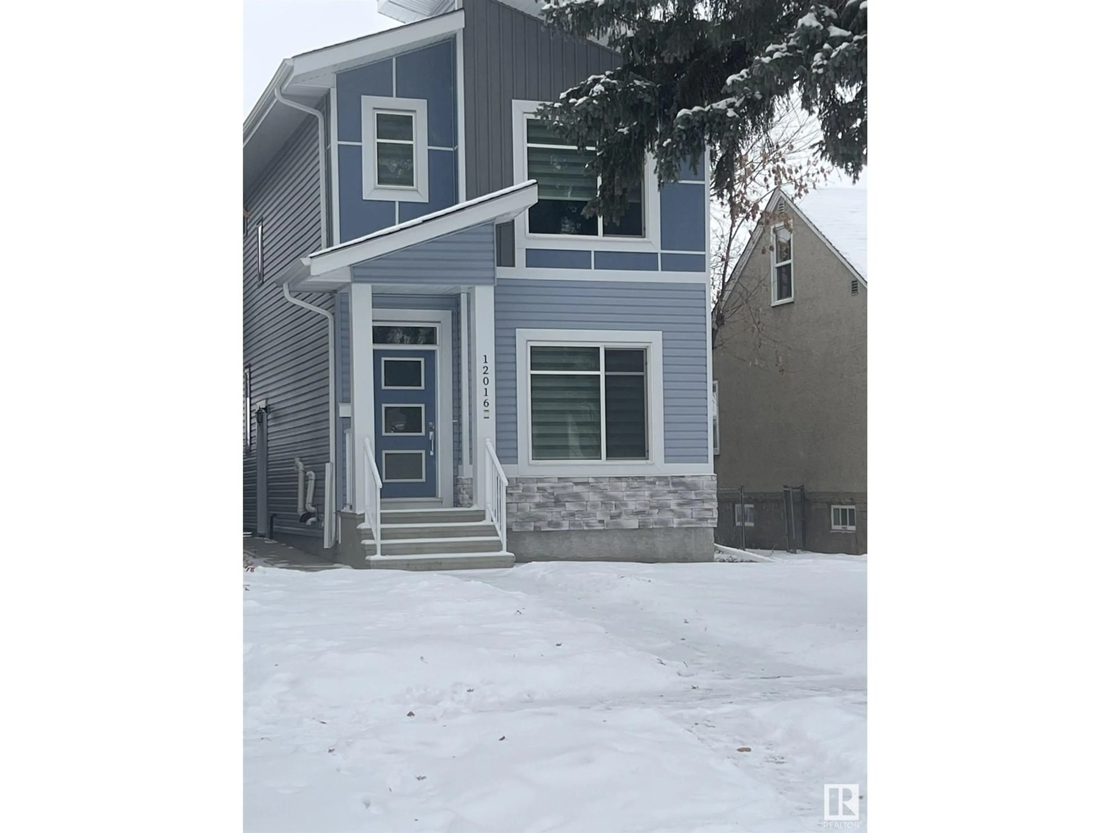 Home with vinyl exterior material, street for 12016 104 ST NW, Edmonton Alberta T5G2L4