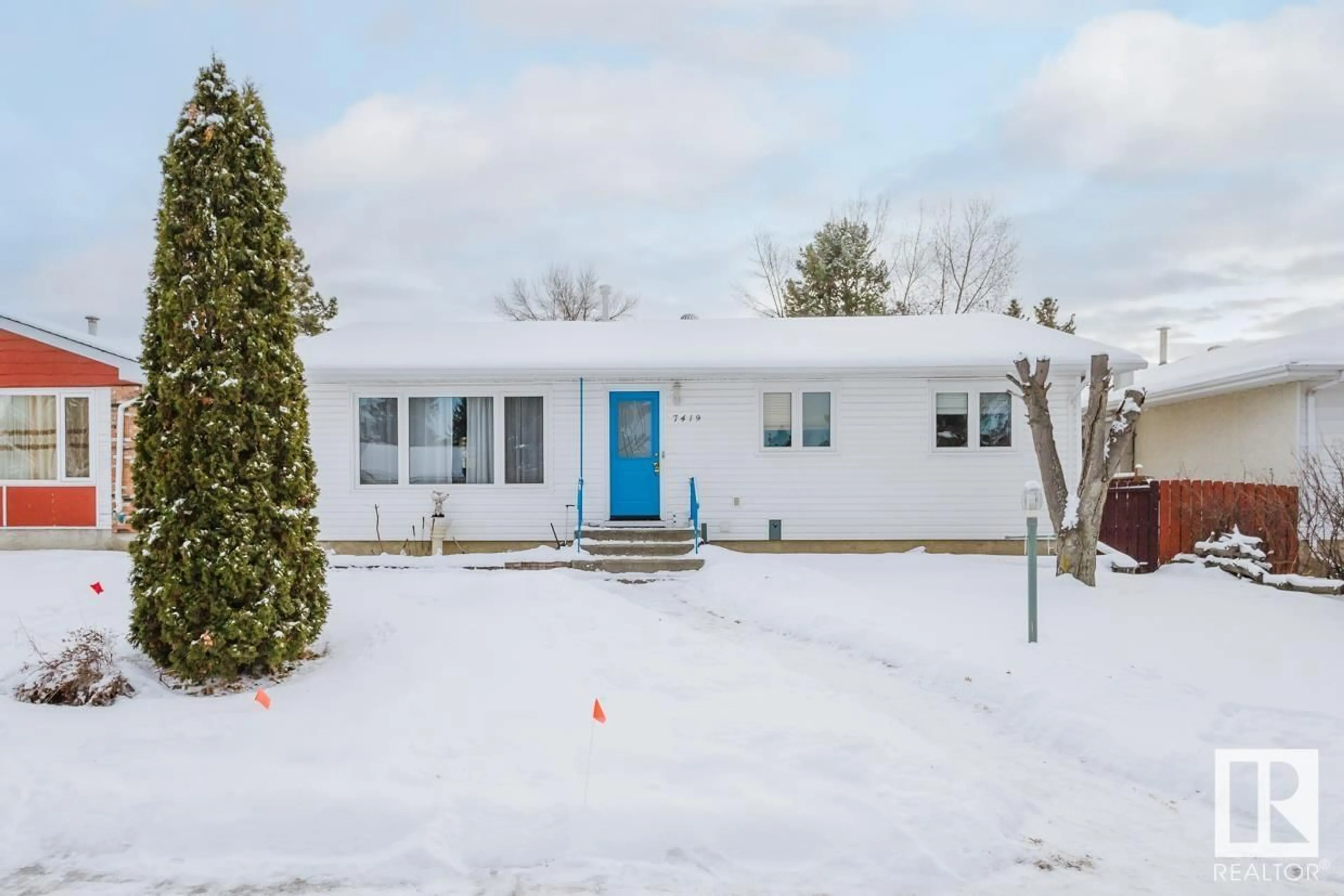 Home with vinyl exterior material, street for 7419 32 AV NW, Edmonton Alberta T6K1J9