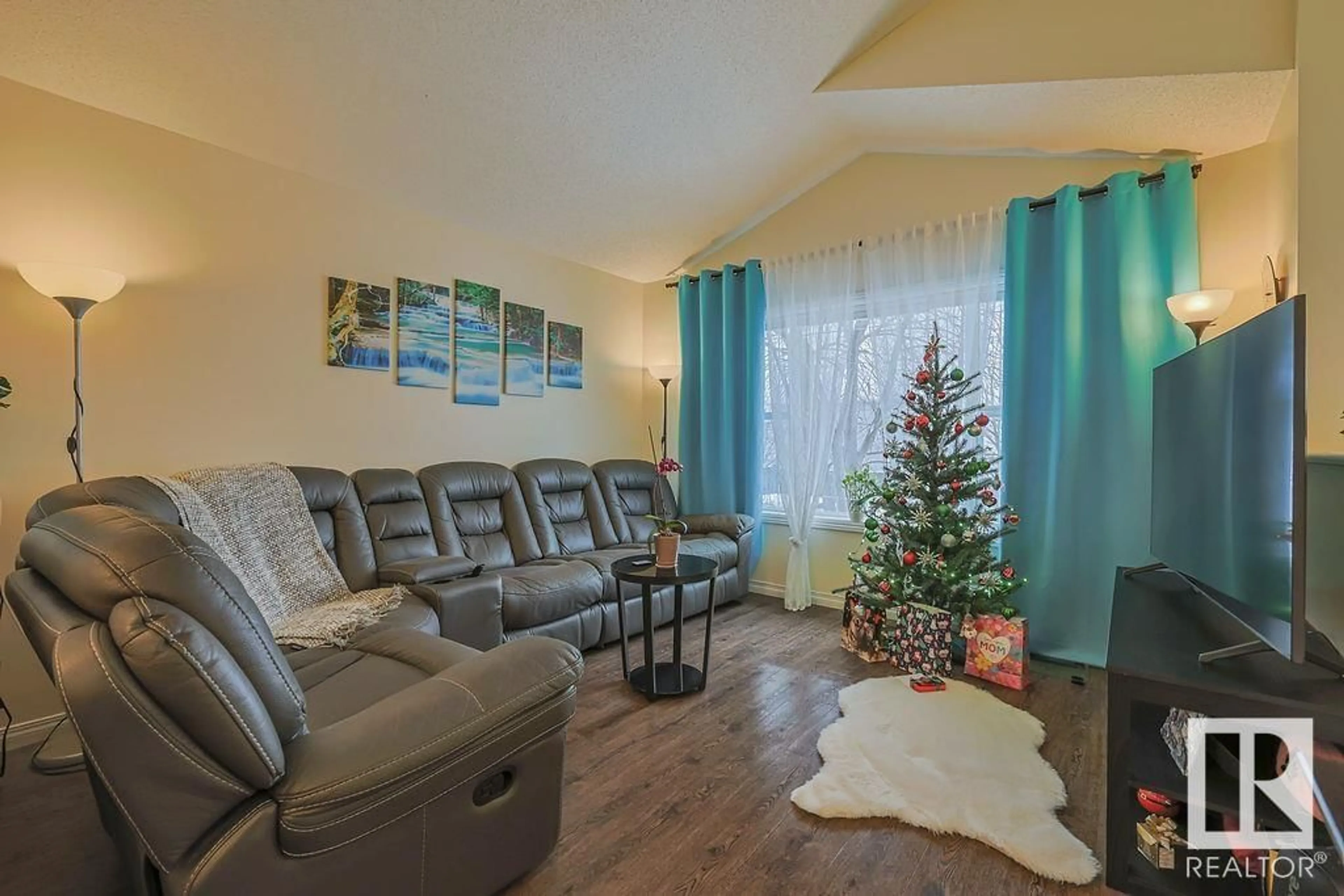 Living room with furniture, wood/laminate floor for 1314 GRANT WY NW, Edmonton Alberta T5T6M8