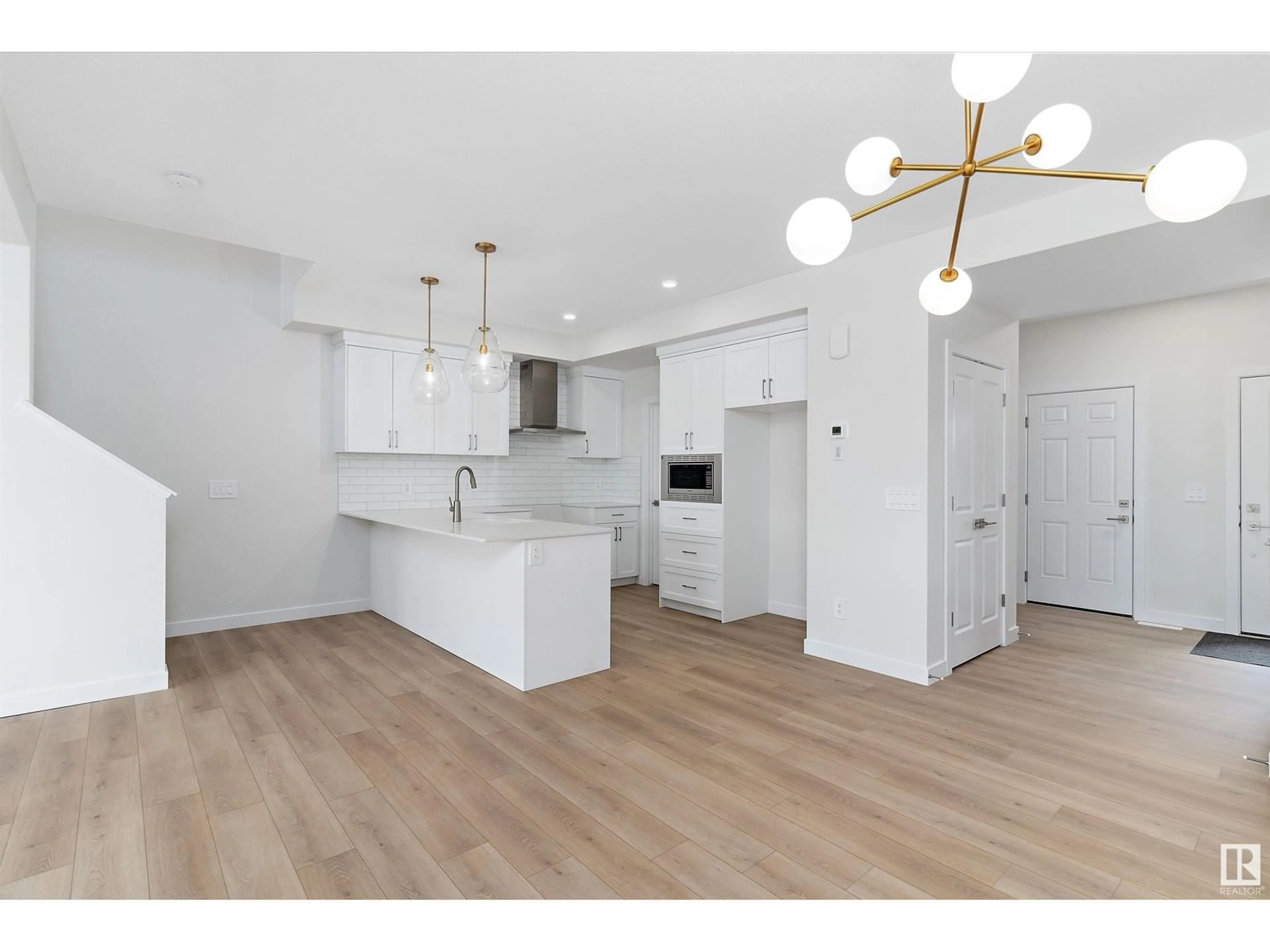 Open concept kitchen, wood/laminate floor for 4841 Cawsey TC SW, Edmonton Alberta T6W5M8