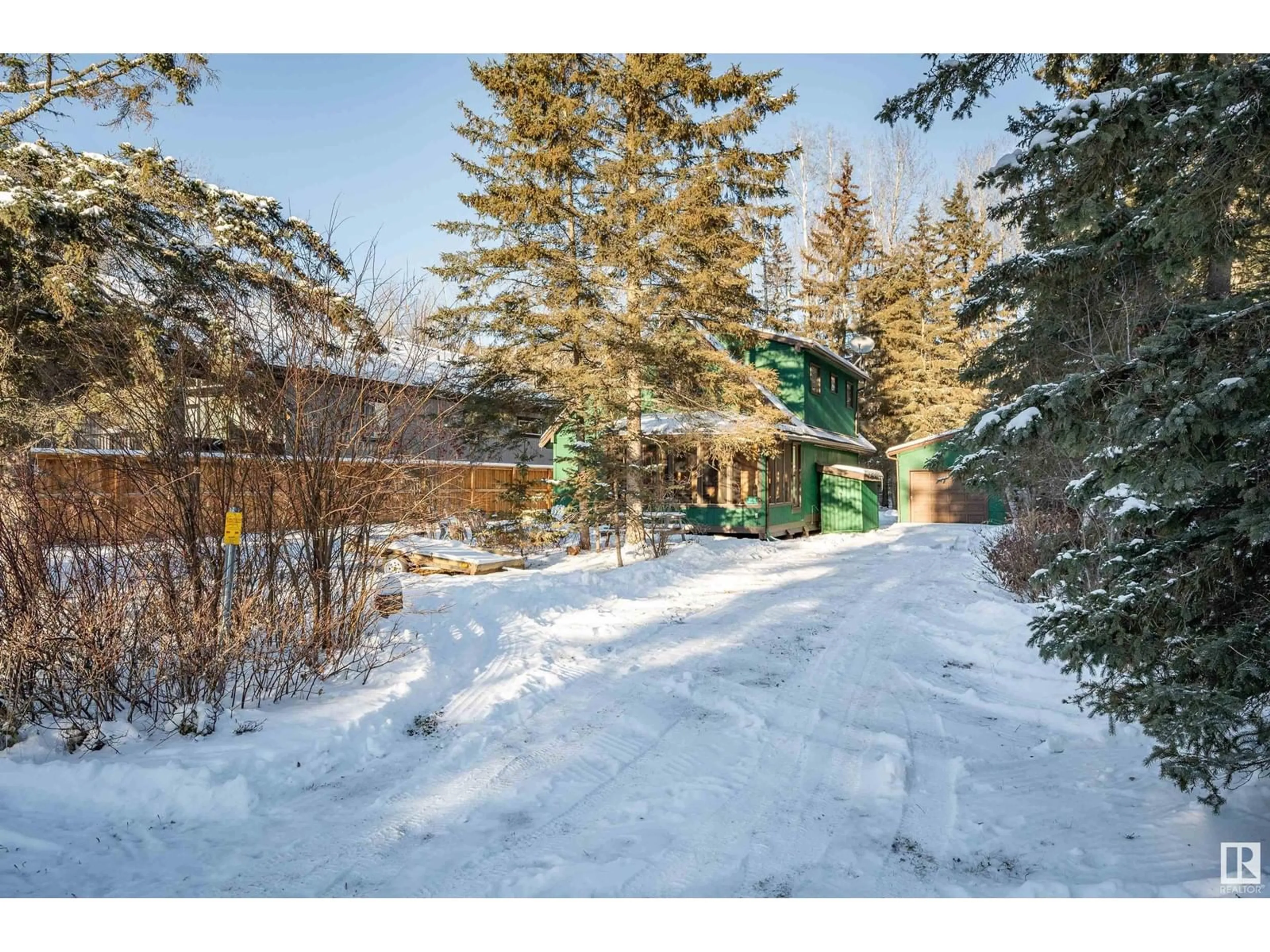 A pic from outside/outdoor area/front of a property/back of a property/a pic from drone, forest/trees view for 1402 Long Lake DR, Long Lake Alberta T0A0M0