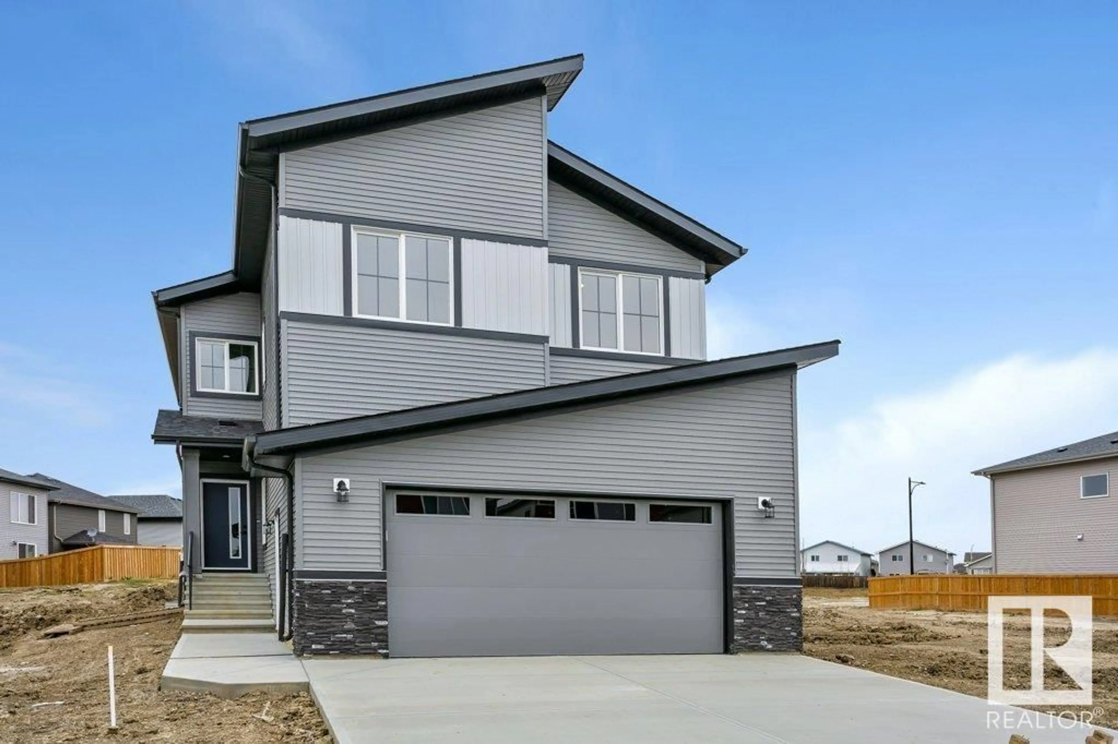 Home with vinyl exterior material, street for 10 Dalquist BA, Leduc Alberta T9E1N7