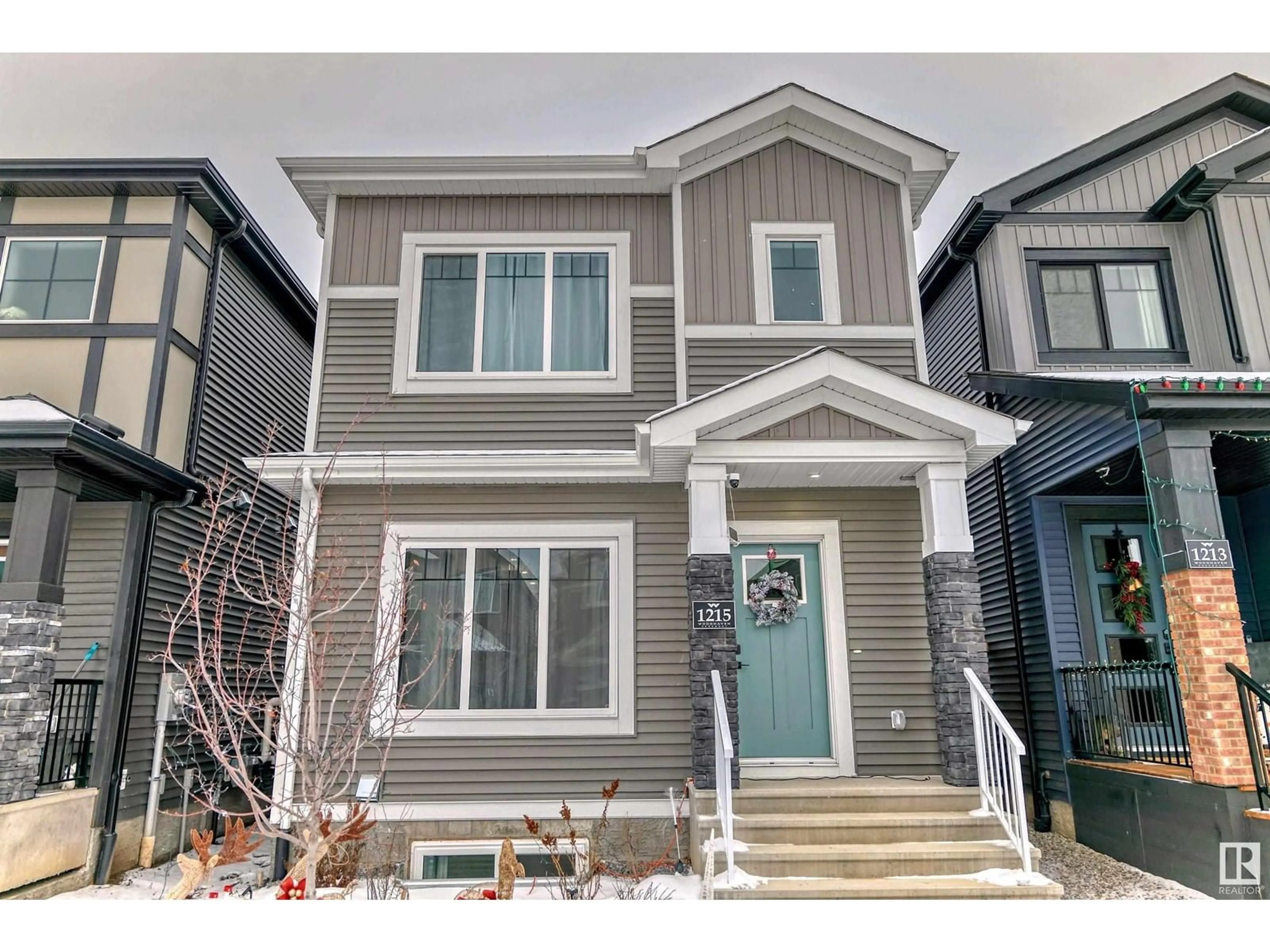 Home with vinyl exterior material, street for 1215 Eaton Lane NW, Edmonton Alberta T6M1M9