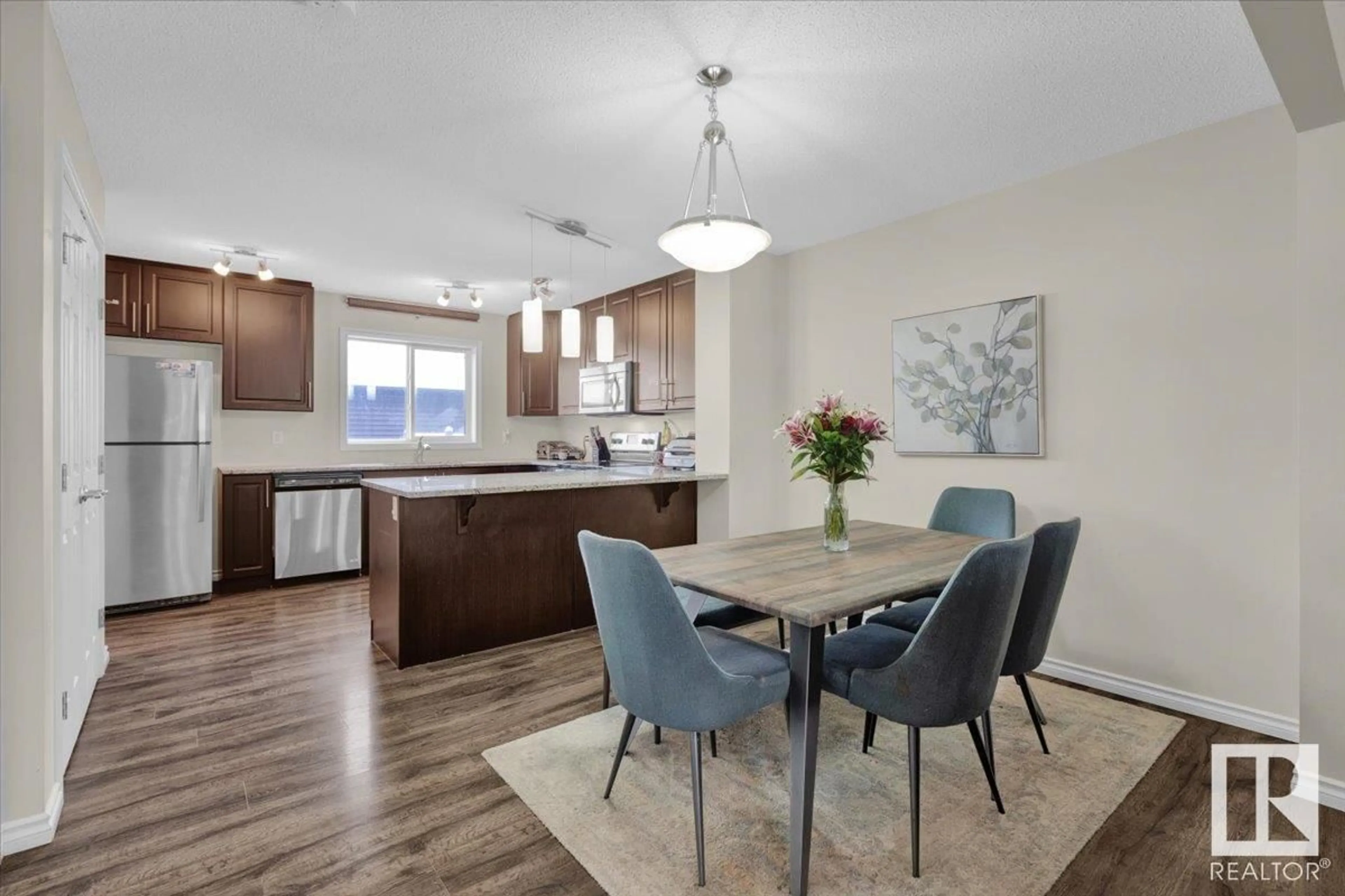 Open concept kitchen, wood/laminate floor for 1396 Watt DR SW, Edmonton Alberta T6X2A6