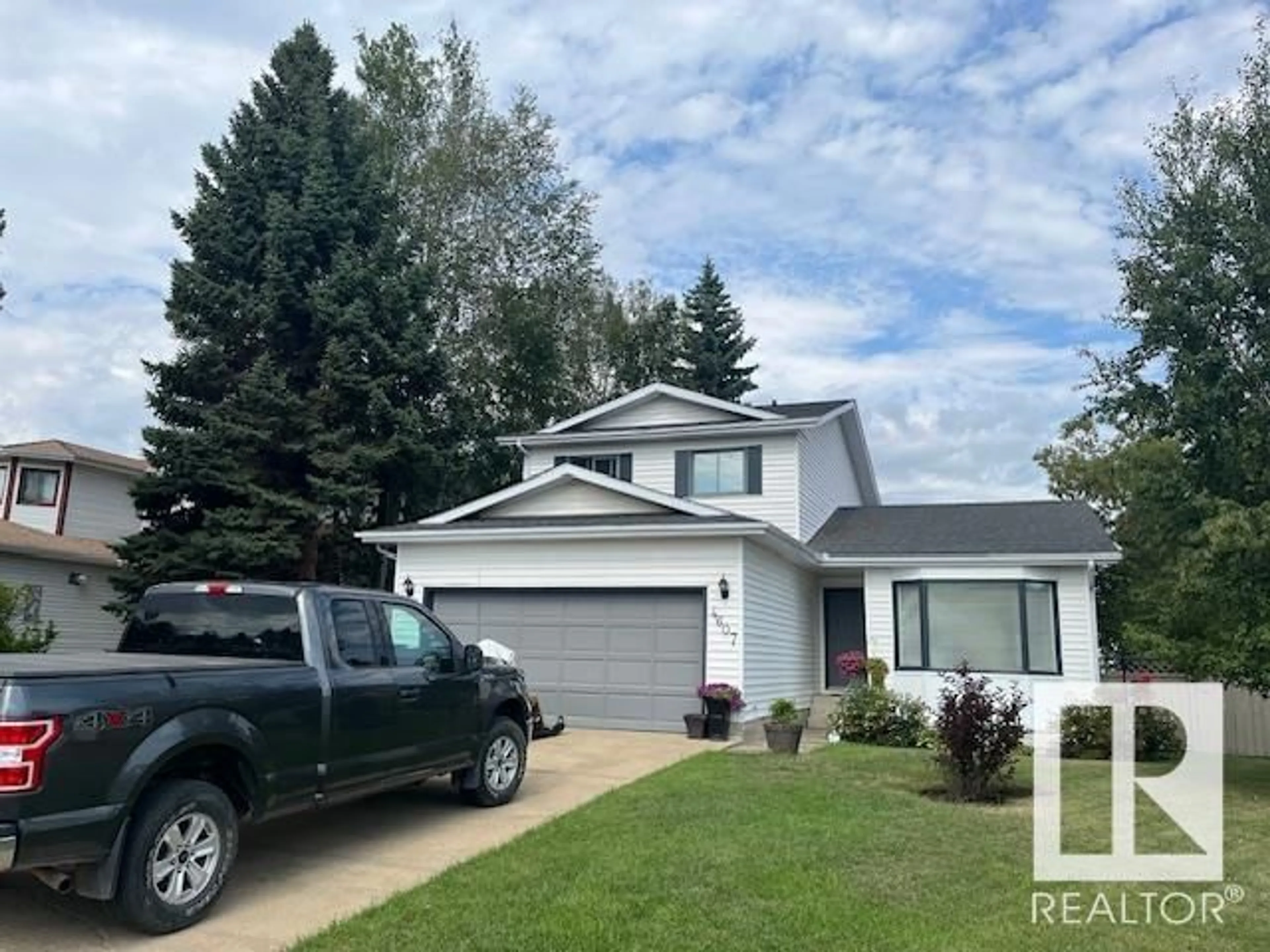 Home with vinyl exterior material, street for 4607 CHAMPAGNE DR, Athabasca Town Alberta T9S1J5