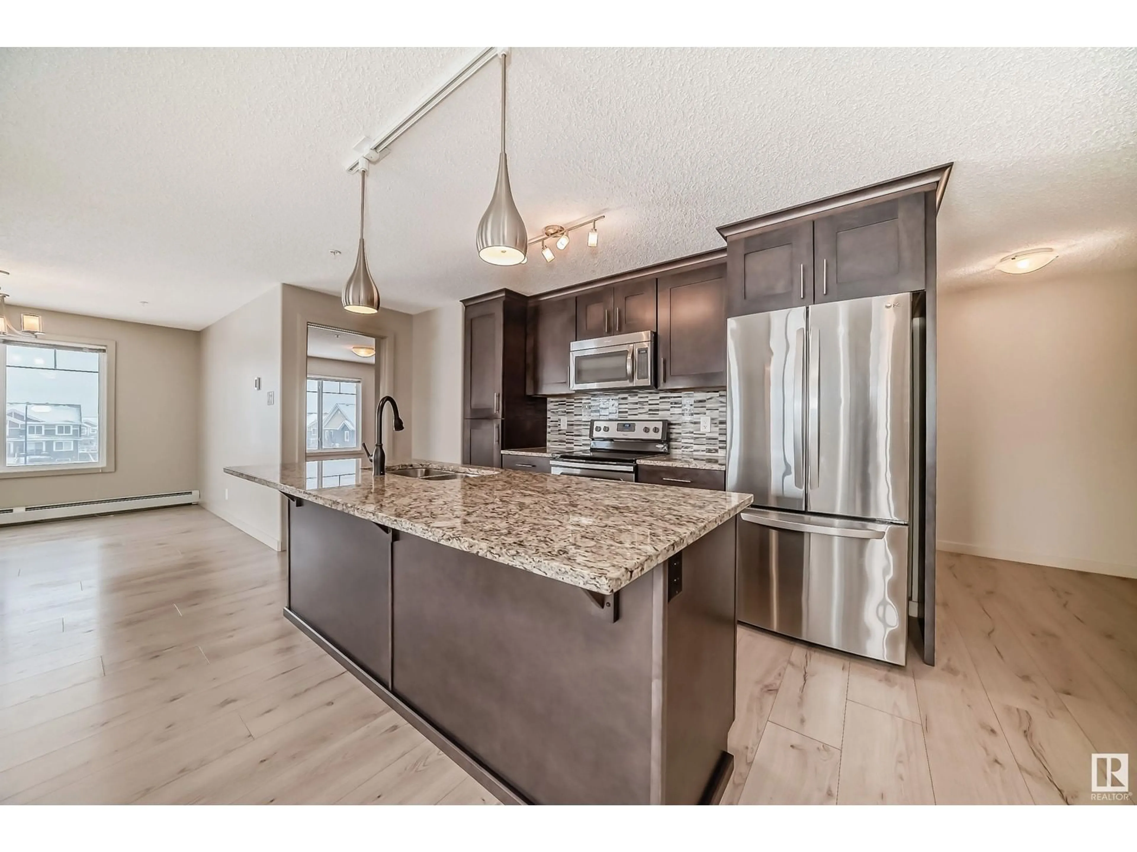 Open concept kitchen, unknown for #302 4008 SAVARYN DR SW, Edmonton Alberta T6X2E5