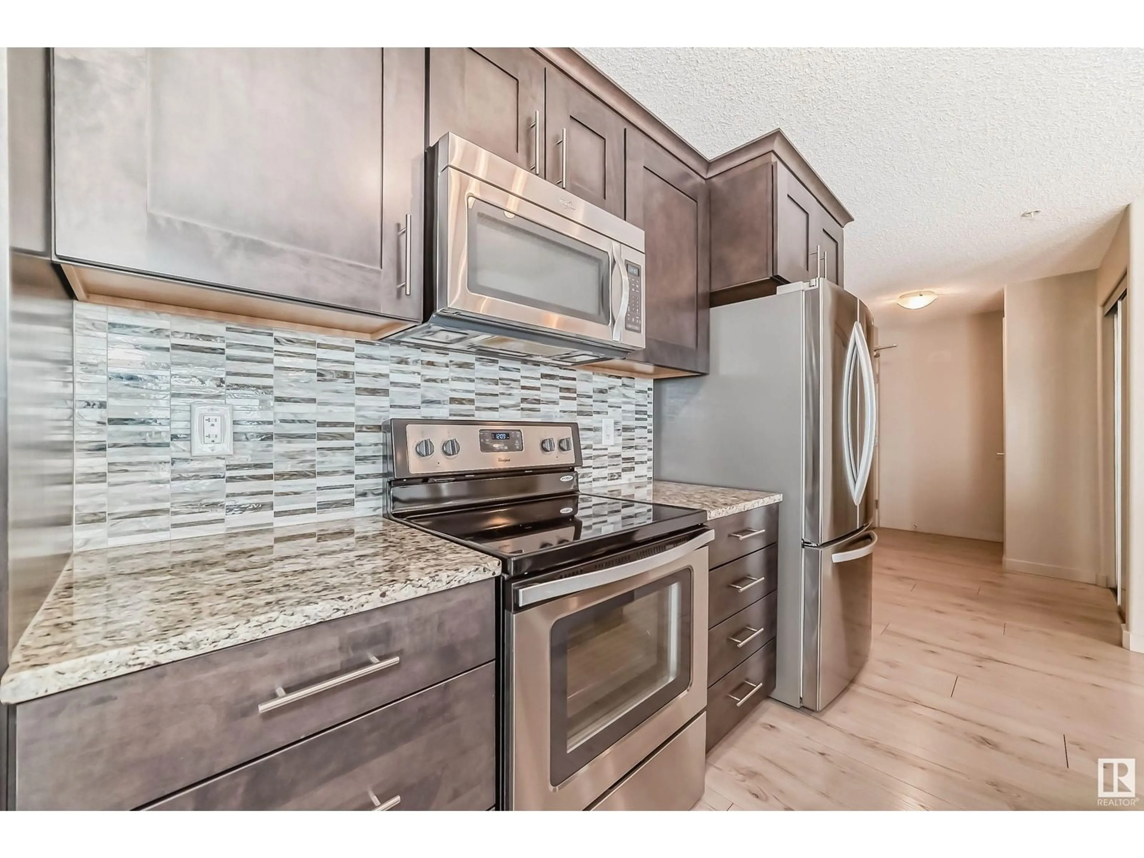 Open concept kitchen, ceramic/tile floor for #302 4008 SAVARYN DR SW, Edmonton Alberta T6X2E5