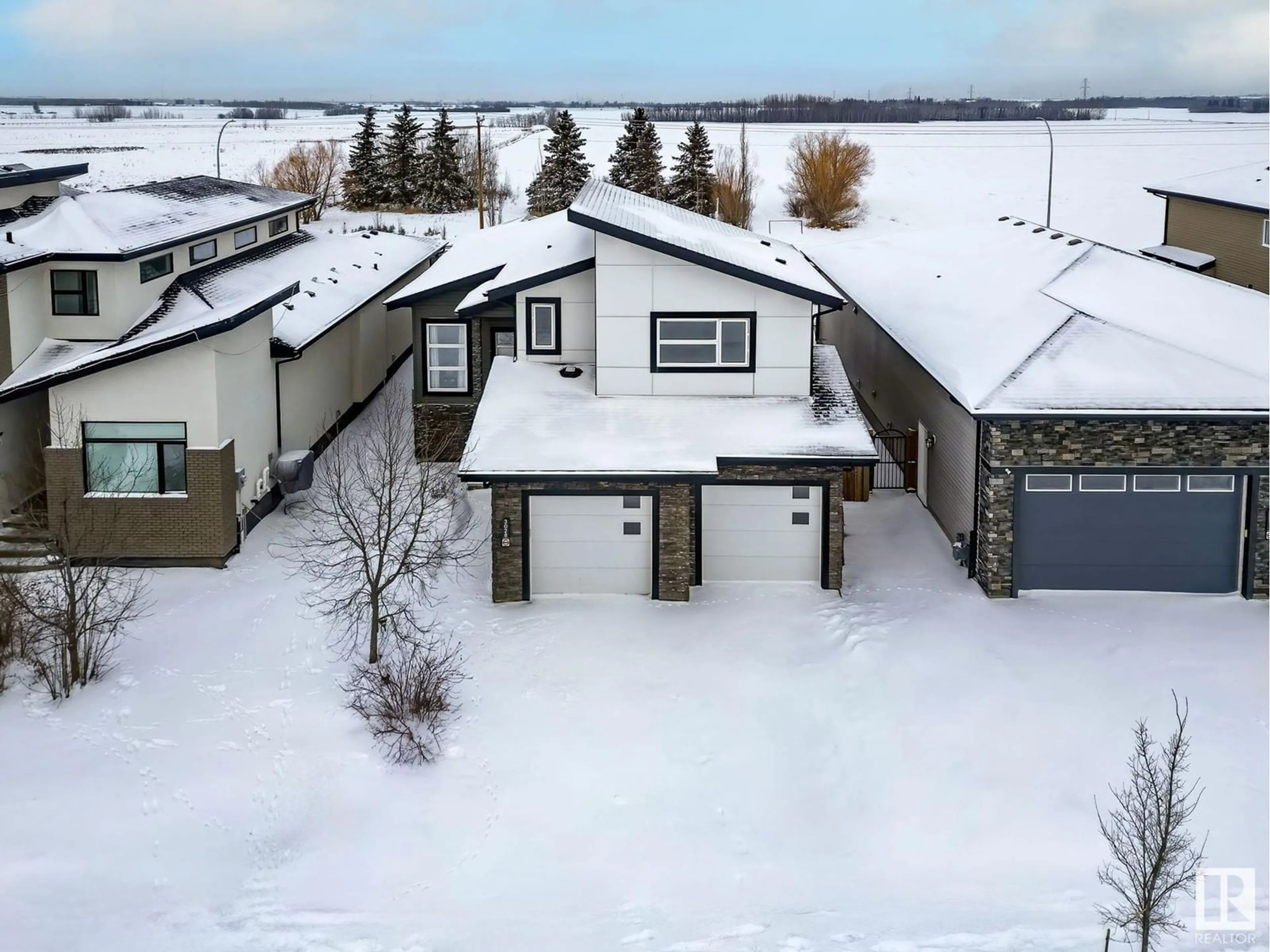 A pic from outside/outdoor area/front of a property/back of a property/a pic from drone, unknown for 3028 58 AV, Rural Leduc County Alberta T4X0X9