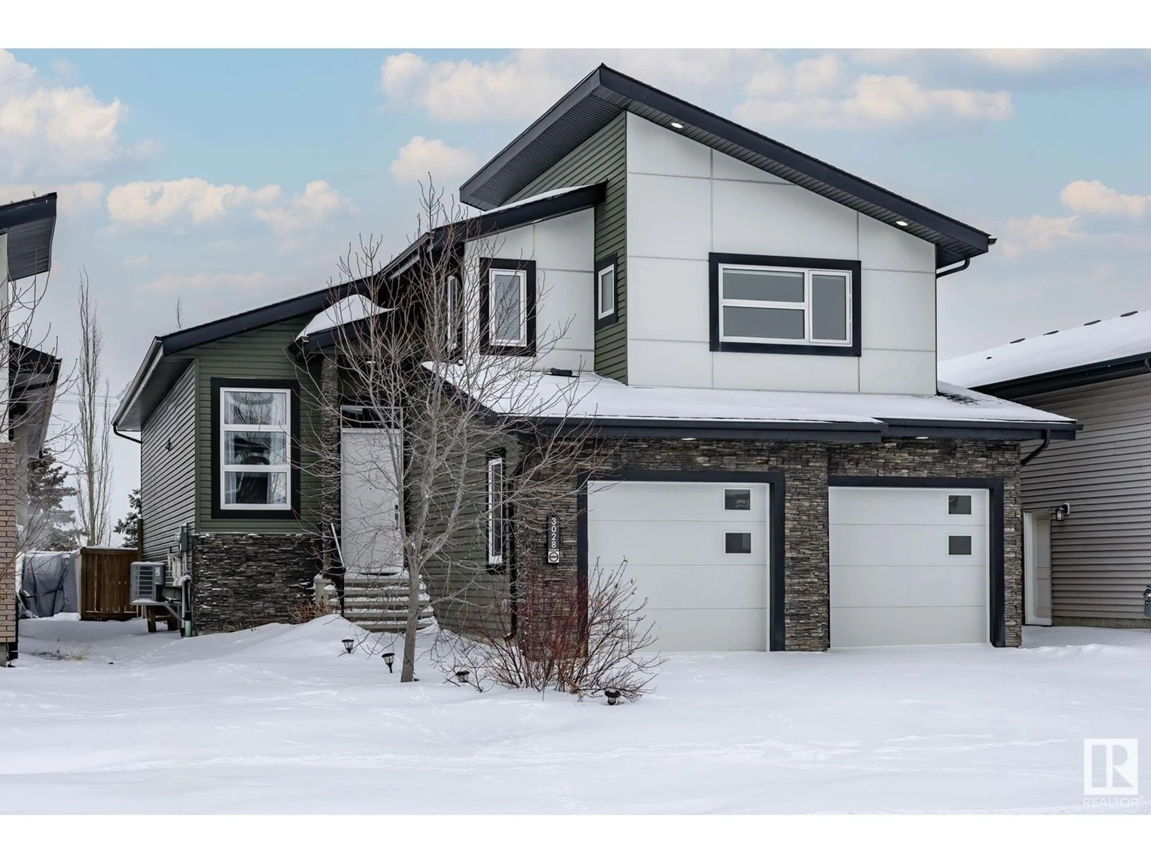 Home with vinyl exterior material, street for 3028 58 AV, Rural Leduc County Alberta T4X0X9