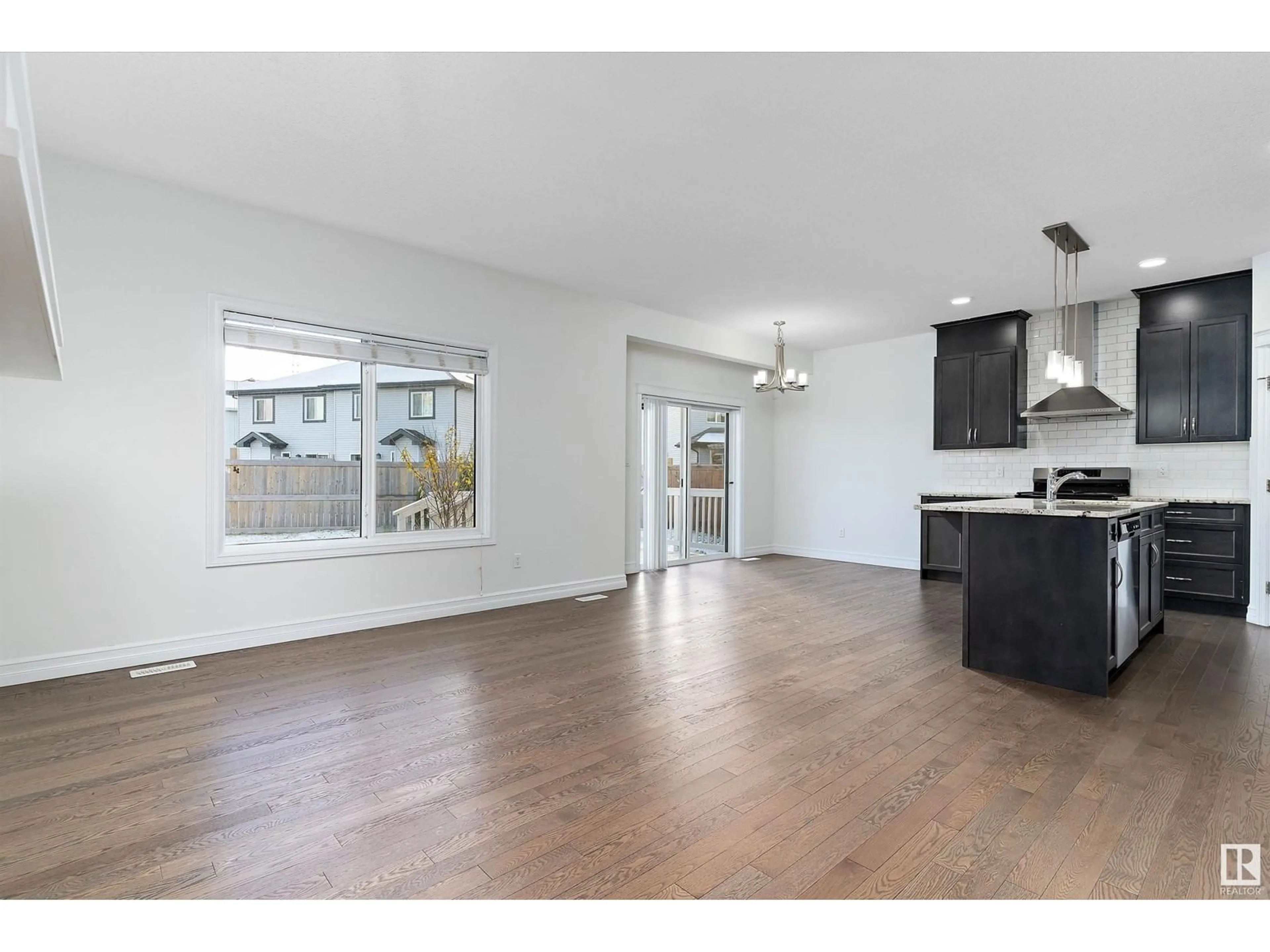 Open concept kitchen, wood/laminate floor for 2805 16A AV NW, Edmonton Alberta T6T0R7