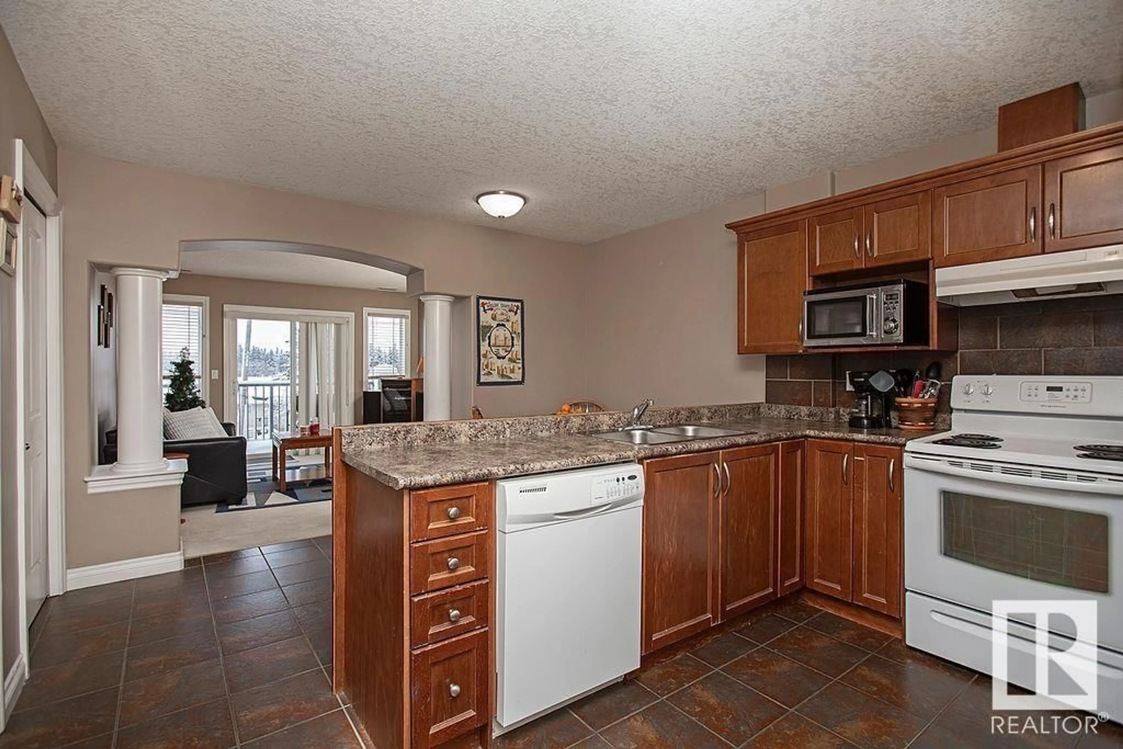 Open concept kitchen, ceramic/tile floor for #304 5204 52 AV, Tofield Alberta T0B4J0