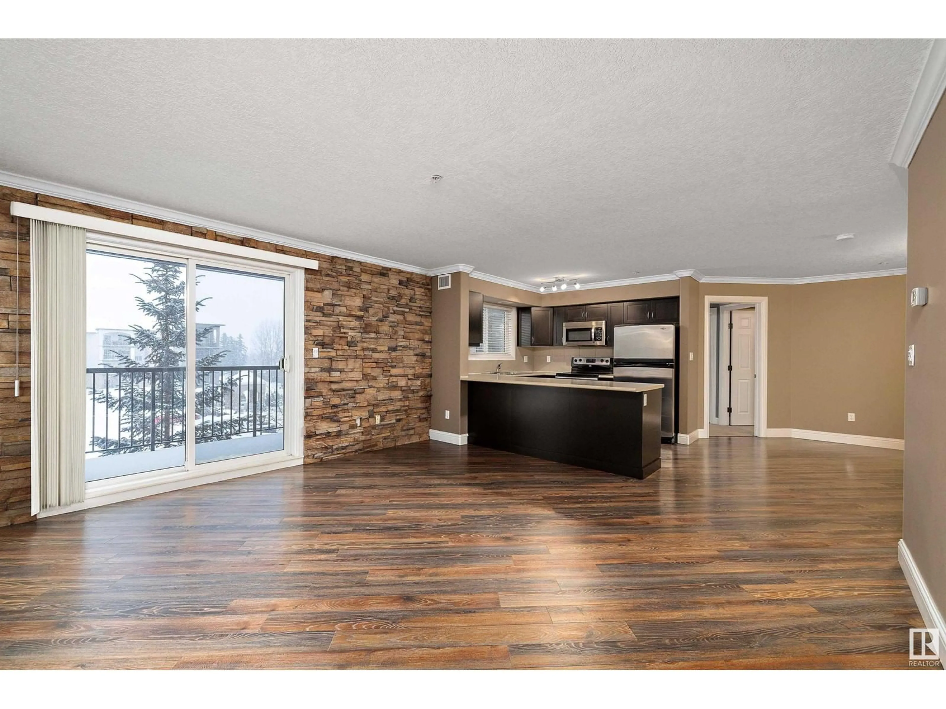 Open concept kitchen, wood/laminate floor for #315 14604 125 ST NW, Edmonton Alberta T5X0B4