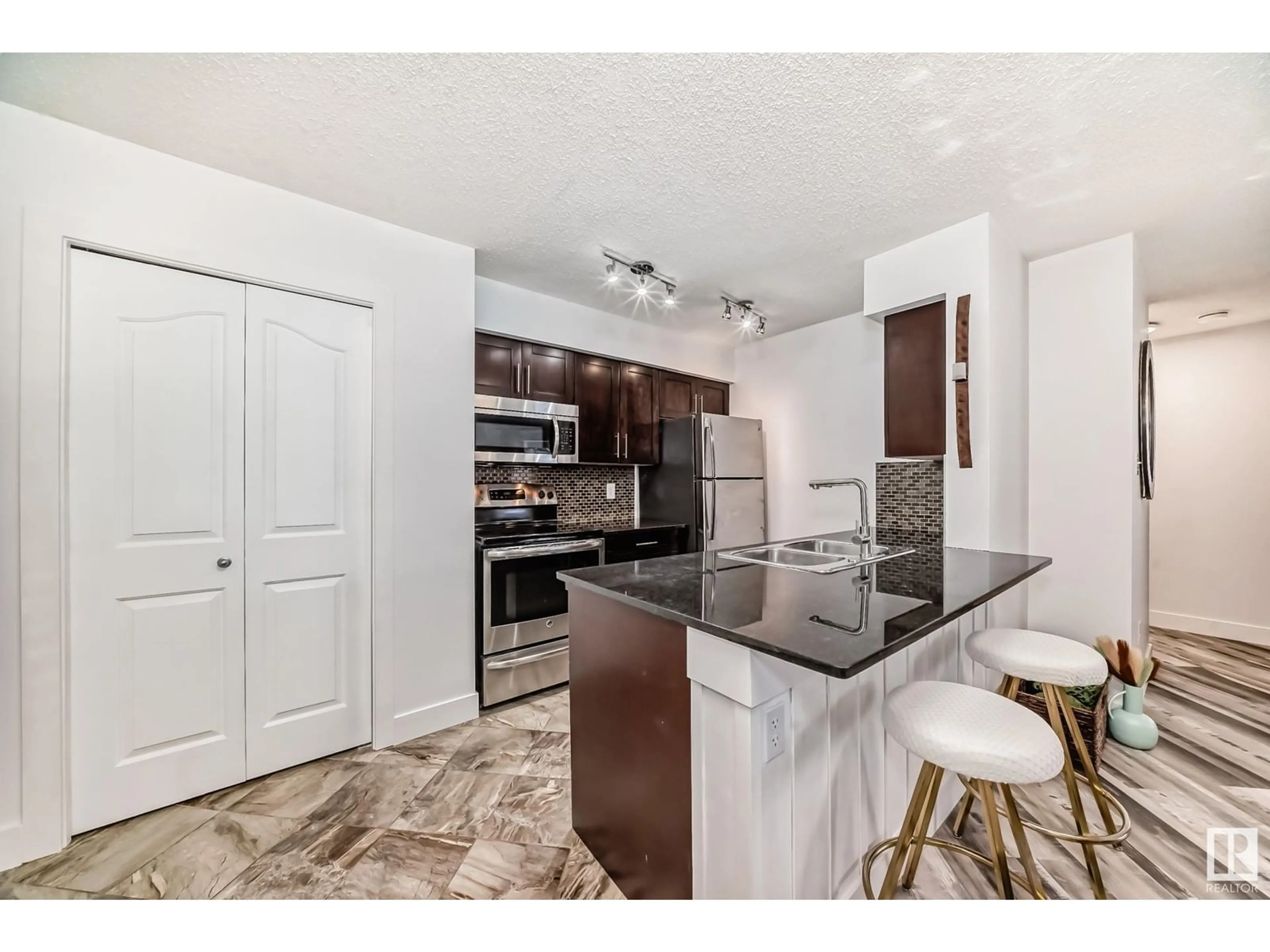 Open concept kitchen, unknown for #109 270 MCCONACHIE DR NW, Edmonton Alberta T5Y3N4