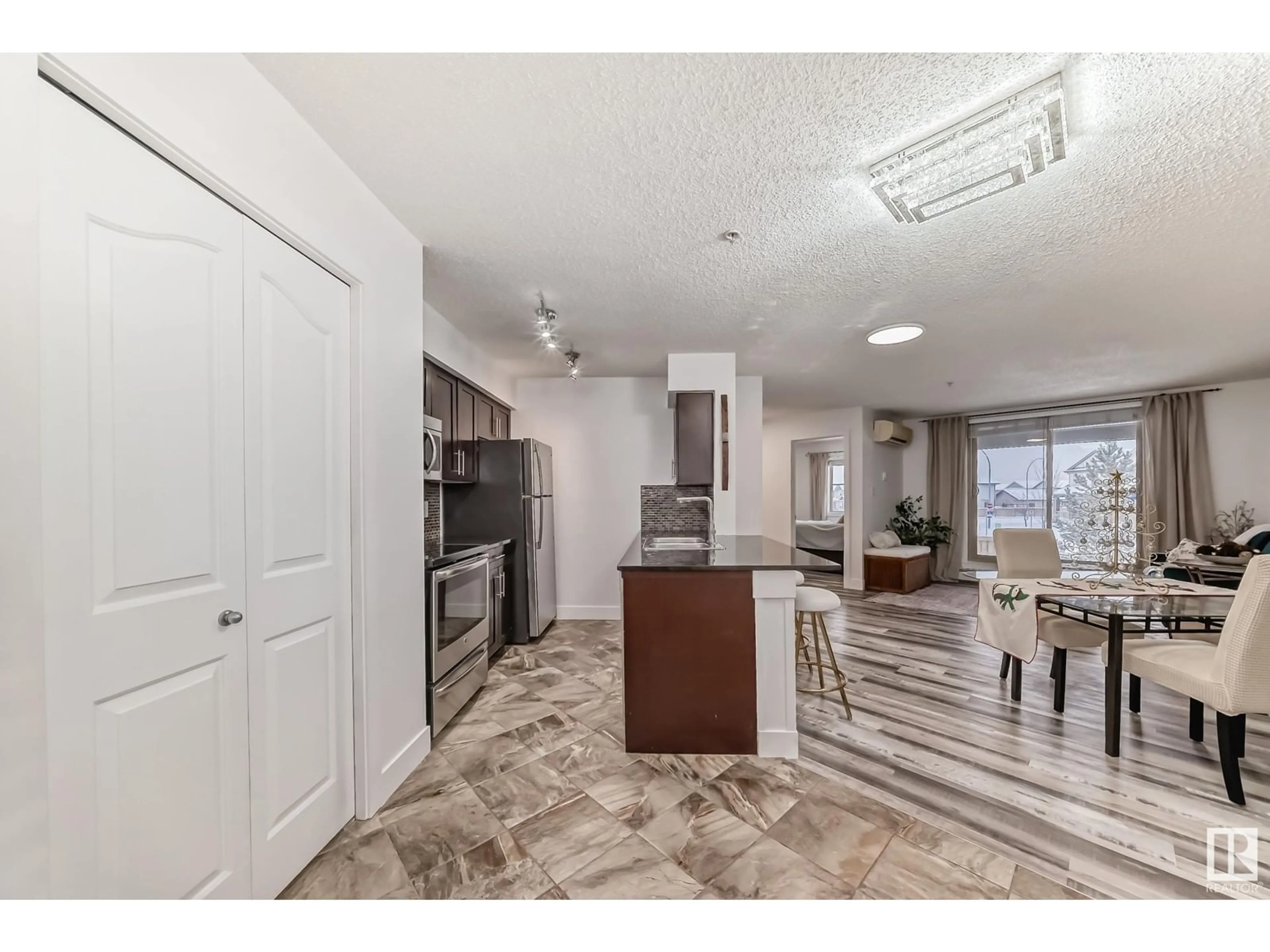 Open concept kitchen, ceramic/tile floor for #109 270 MCCONACHIE DR NW, Edmonton Alberta T5Y3N4