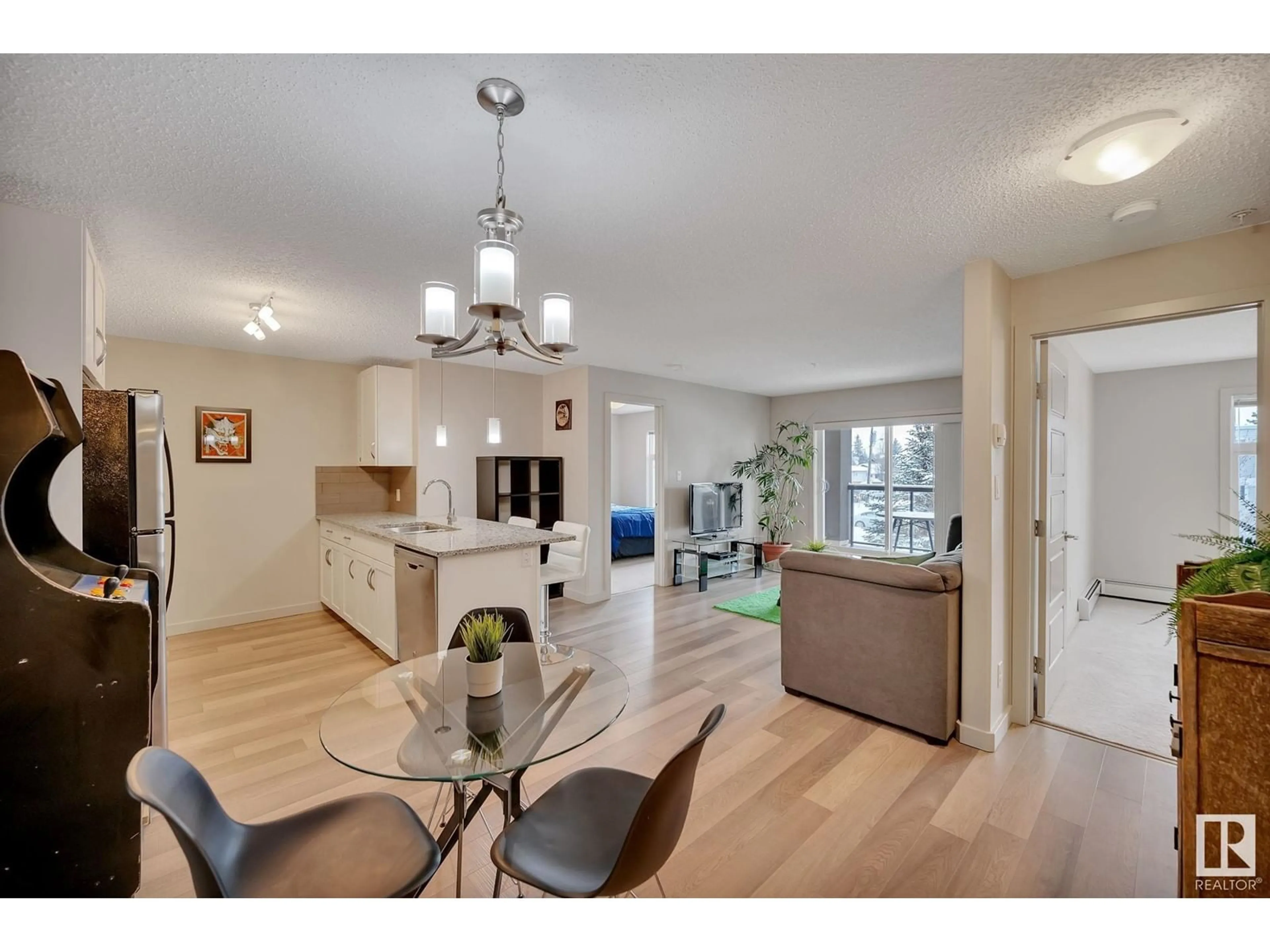 Open concept kitchen, wood/laminate floor for #259 7805 71 ST NW, Edmonton Alberta T6B3V6