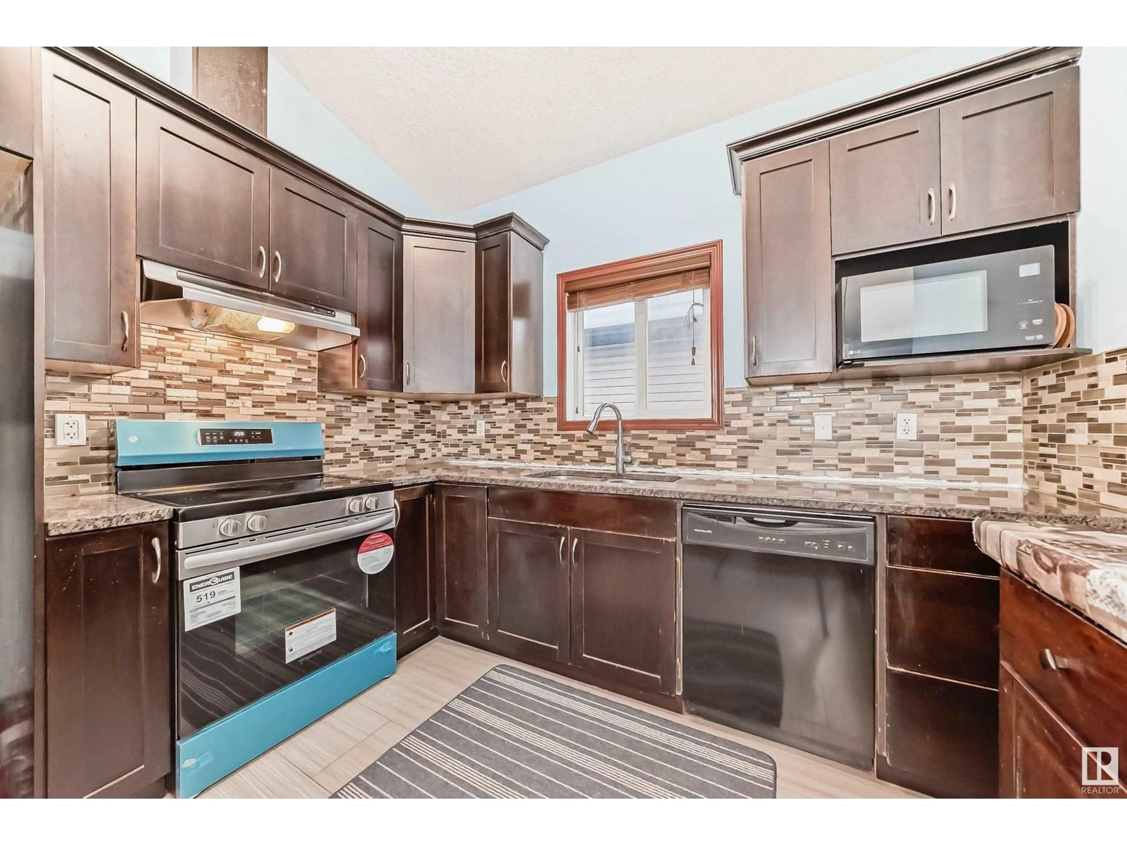 Open concept kitchen, ceramic/tile floor for 11916 91 ST NW, Edmonton Alberta T5B4B6