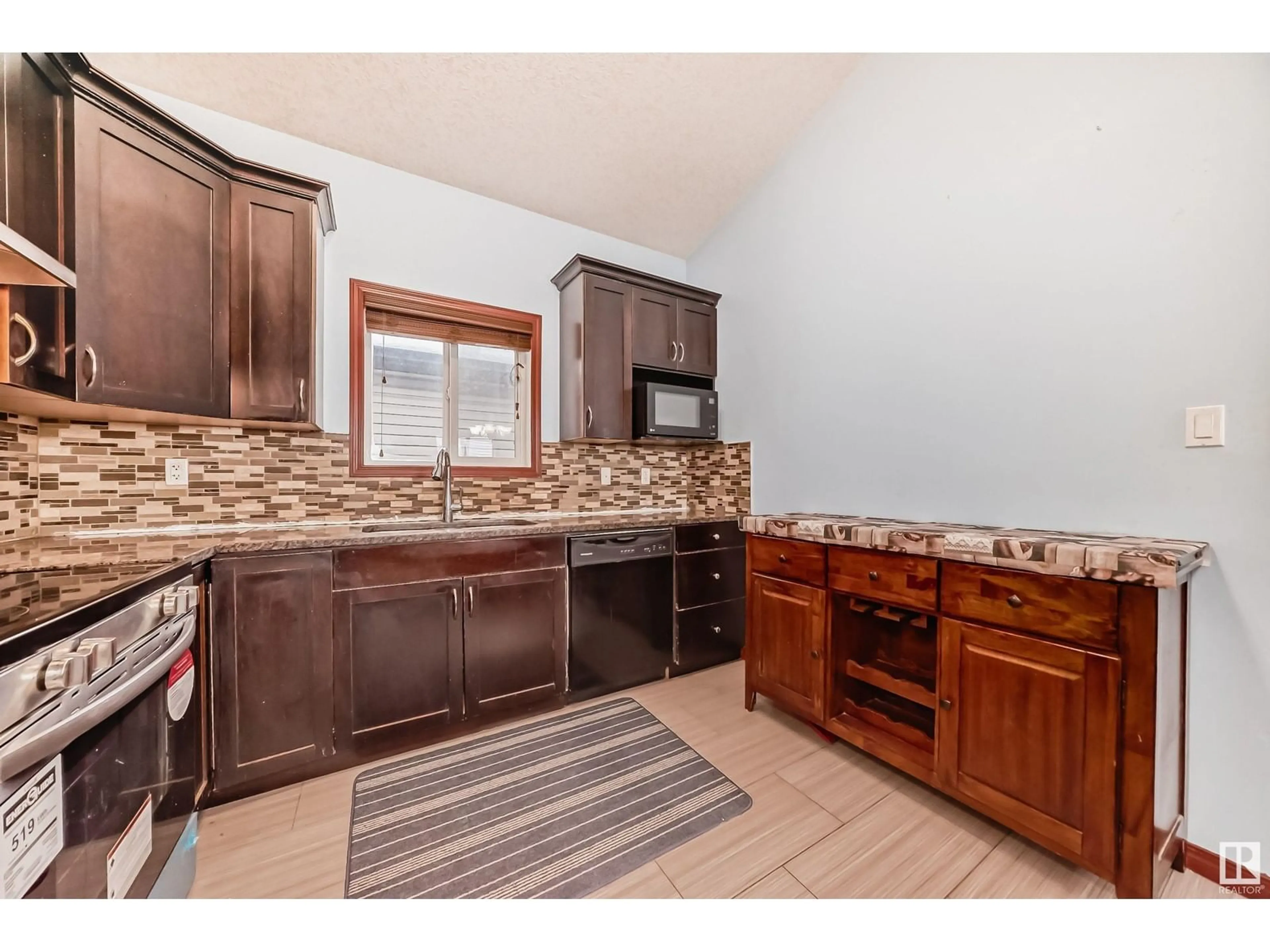 Open concept kitchen, ceramic/tile floor for 11916 91 ST NW, Edmonton Alberta T5B4B6