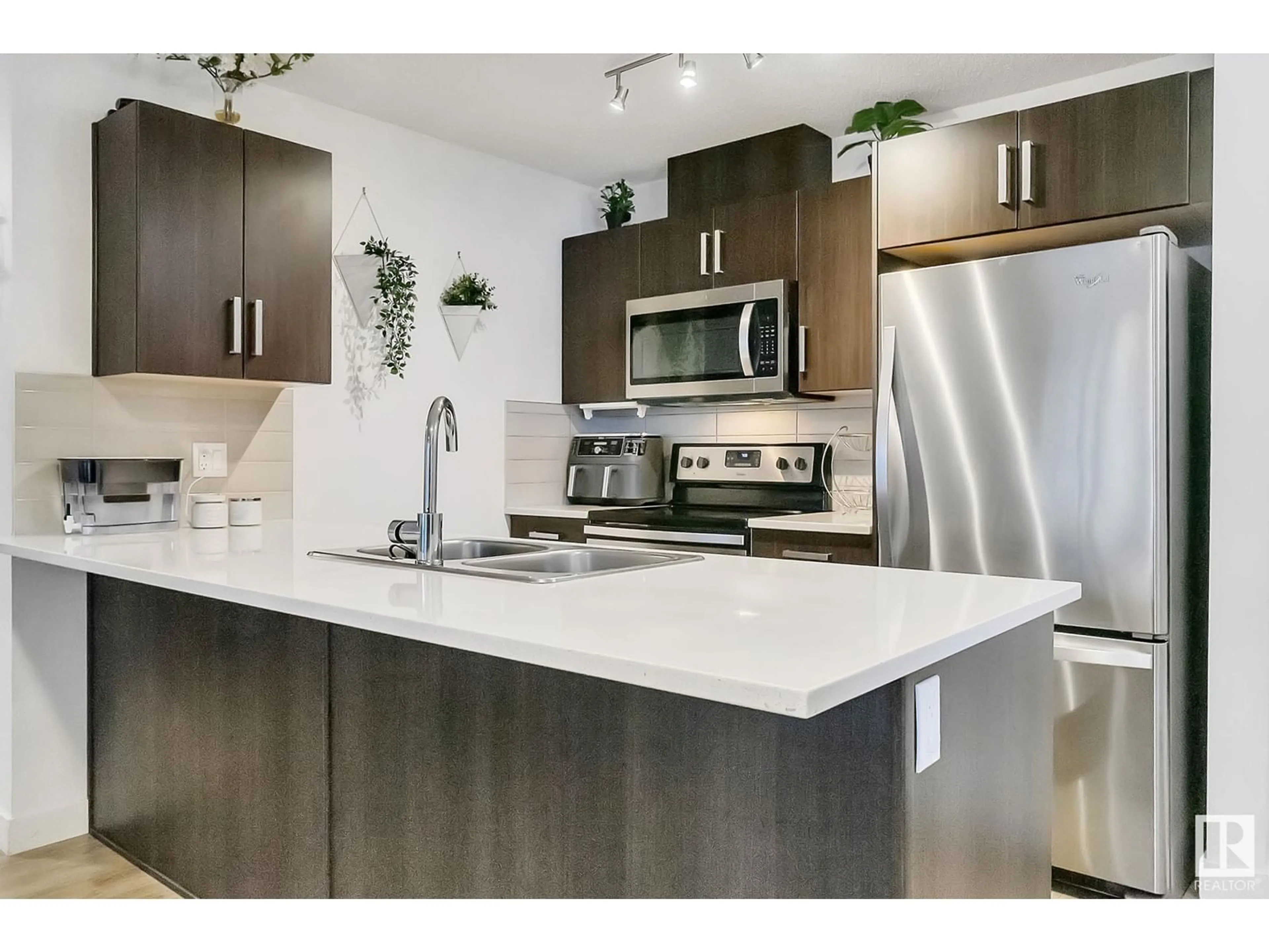 Open concept kitchen, unknown for #214 667 WATT BV SW, Edmonton Alberta T6X0Y2