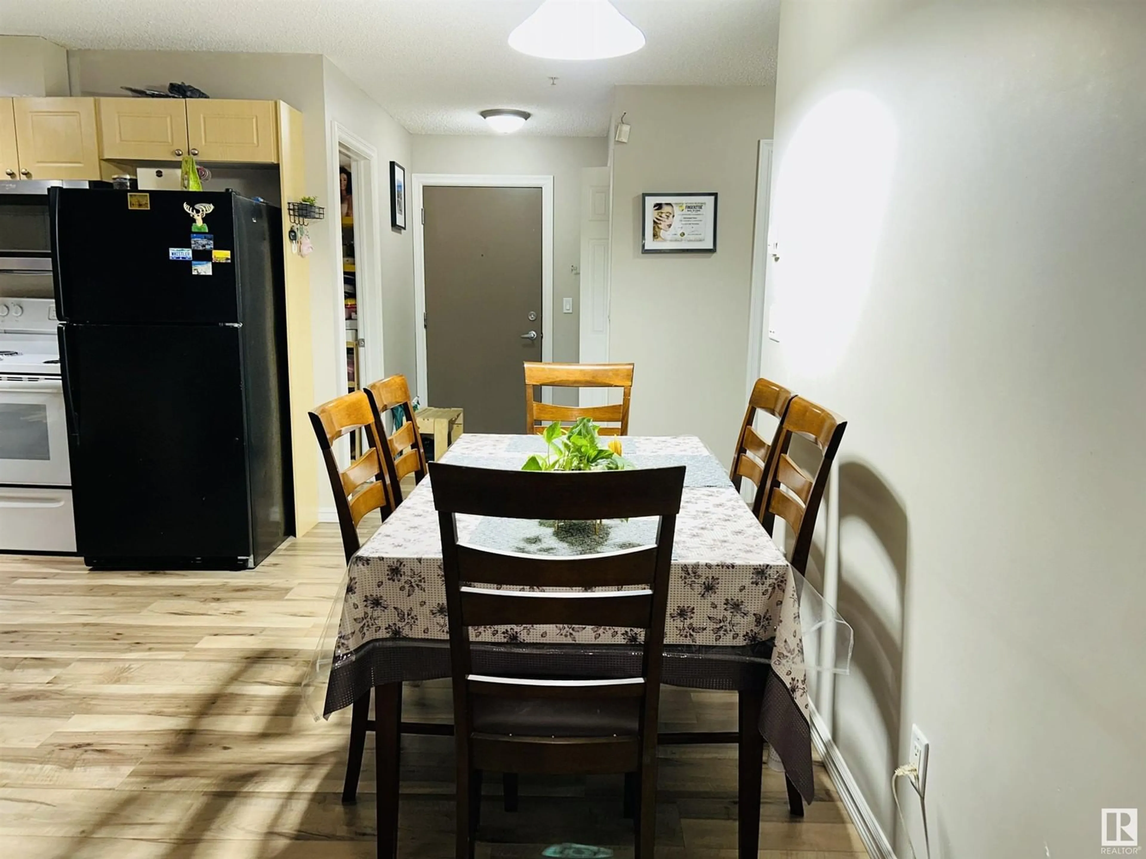 Dining room, wood/laminate floor for #104 4407 23 ST NW NW, Edmonton Alberta T6T0B6