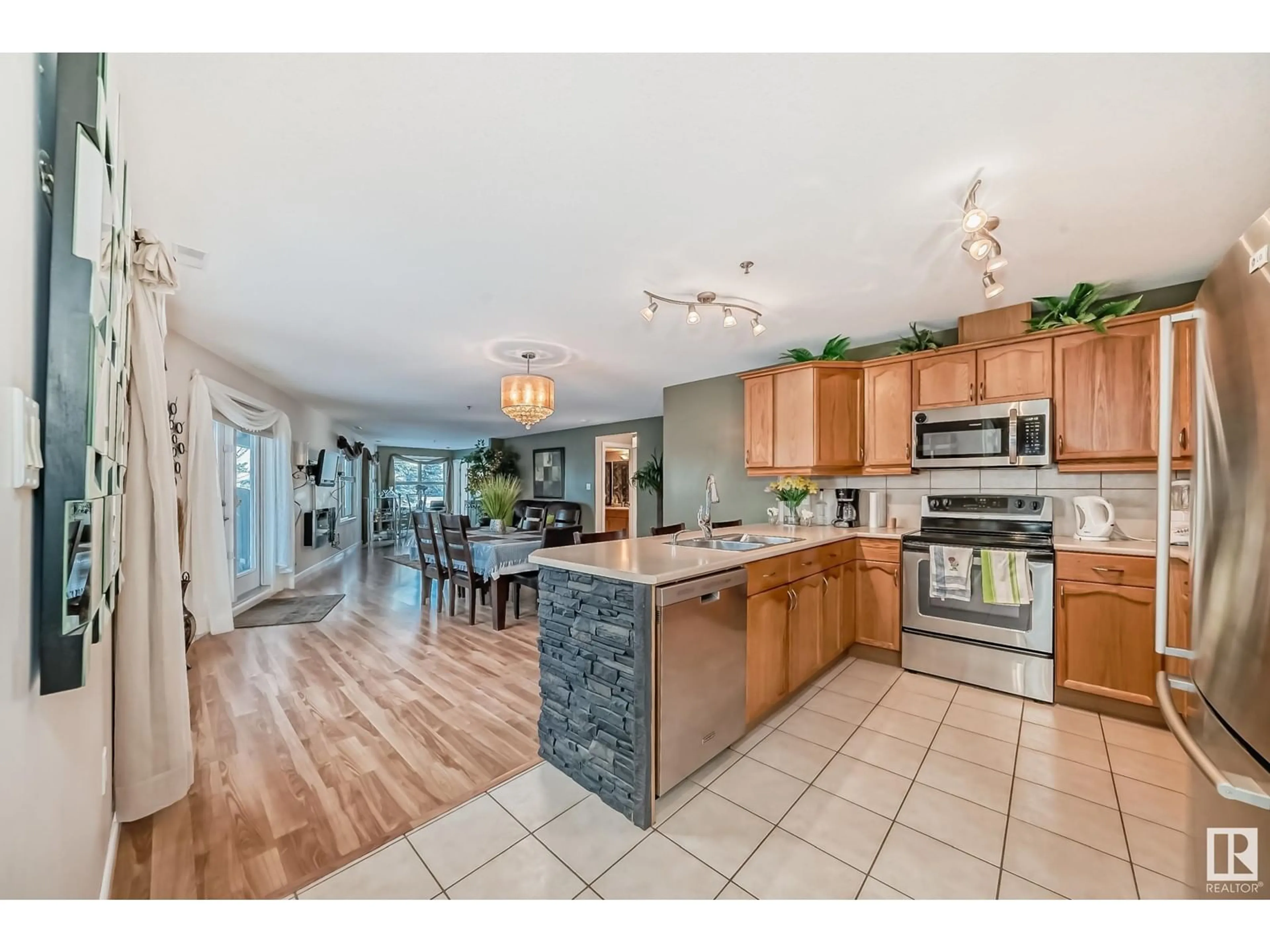 Open concept kitchen, ceramic/tile floor for #111 530 HOOKE RD NW, Edmonton Alberta T5A5J5