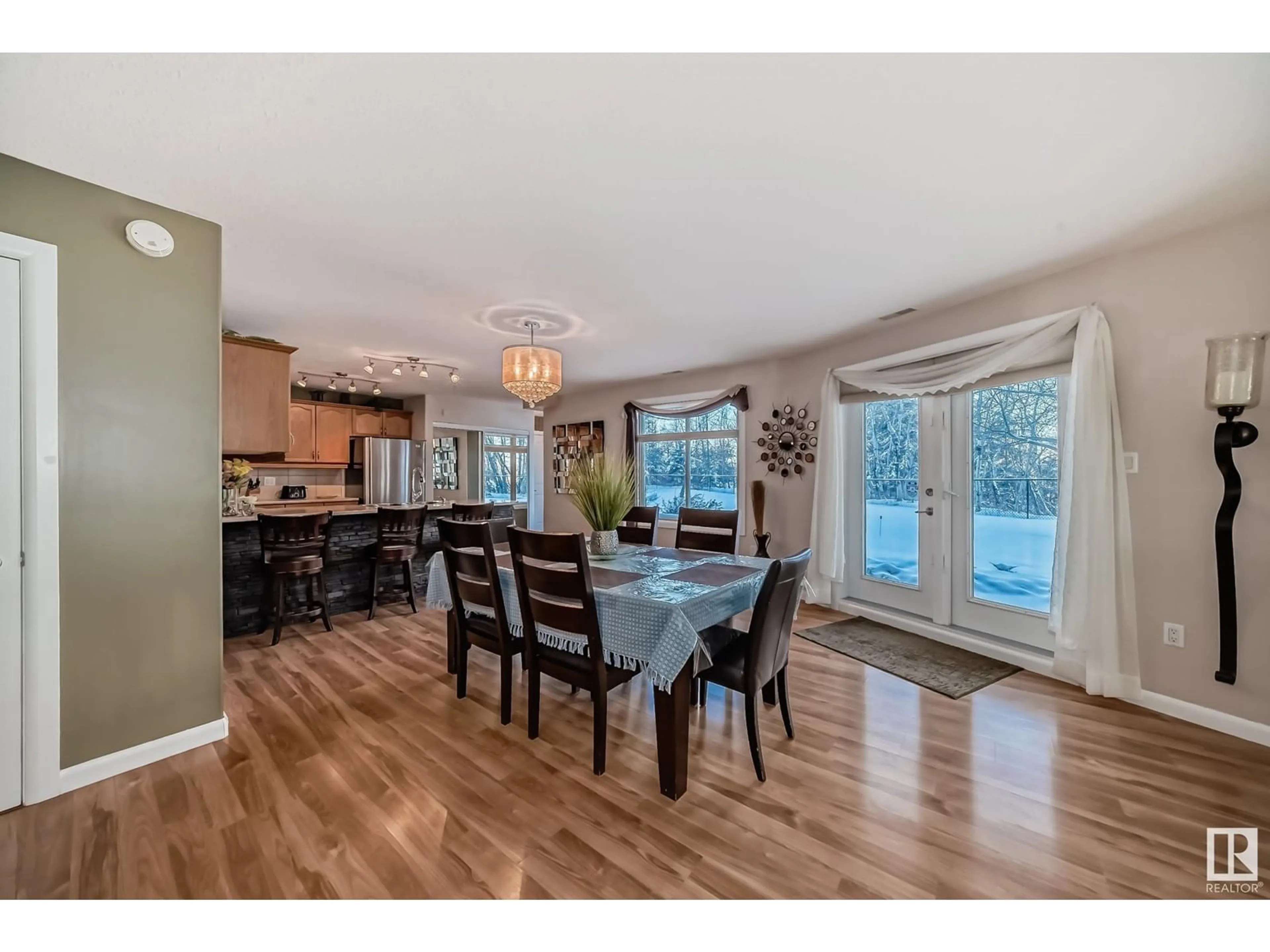 Open concept kitchen, wood/laminate floor for #111 530 HOOKE RD NW, Edmonton Alberta T5A5J5