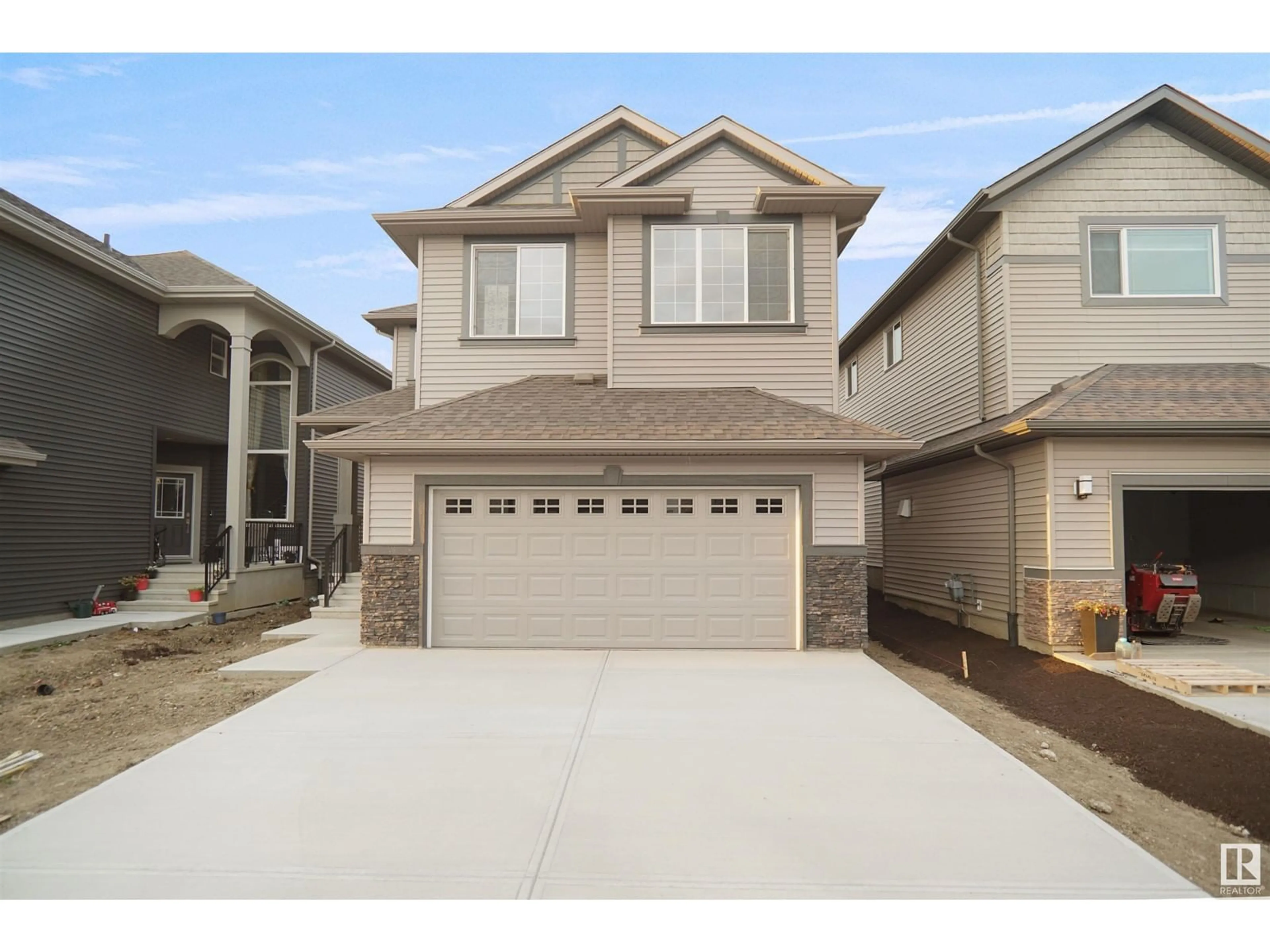 Home with vinyl exterior material, street for 275 GLENRIDDING RAVINE RD SW, Edmonton Alberta T6W5C3