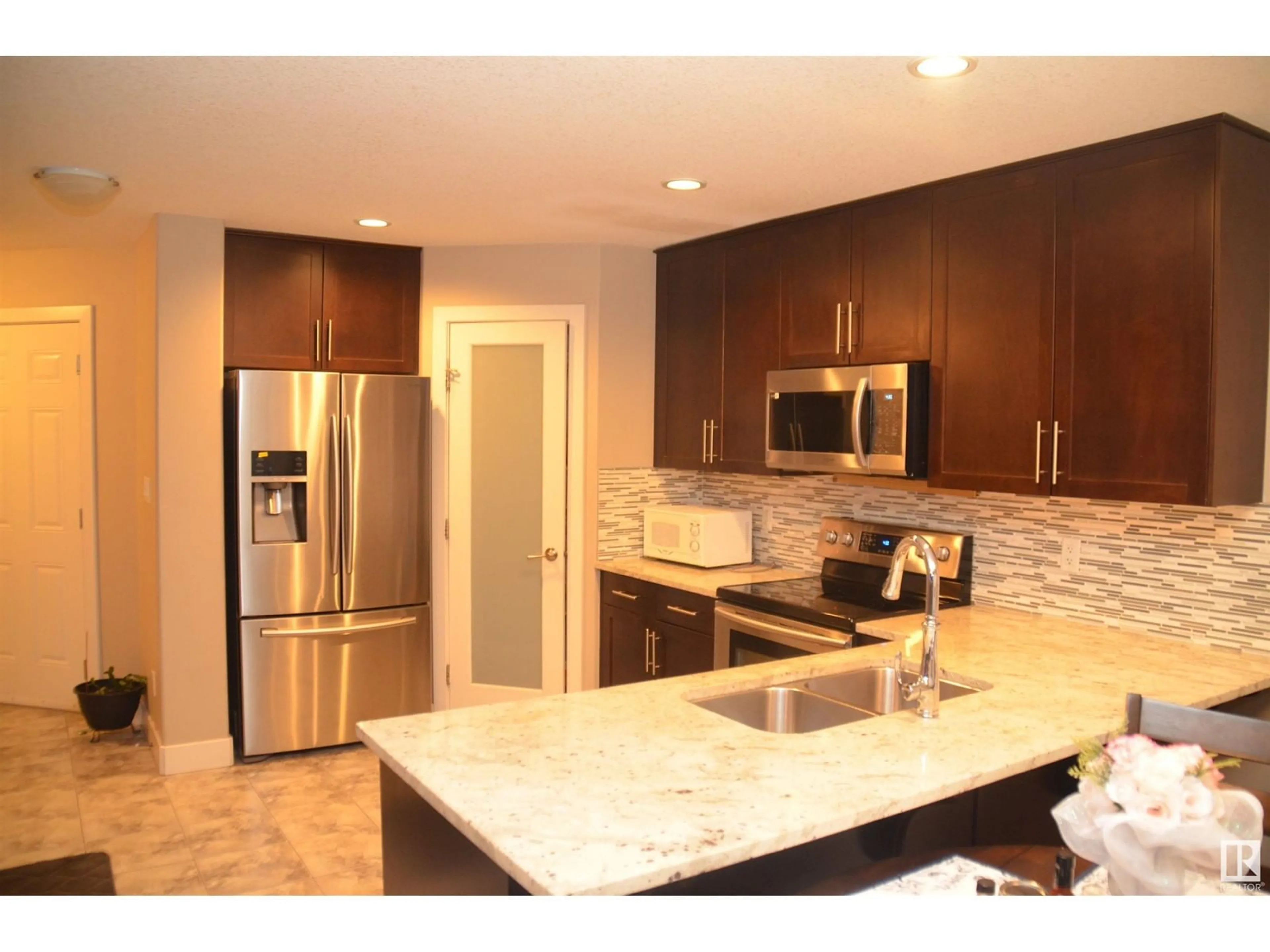 Open concept kitchen, unknown for 16715 60 ST NW, Edmonton Alberta T5Y0S7