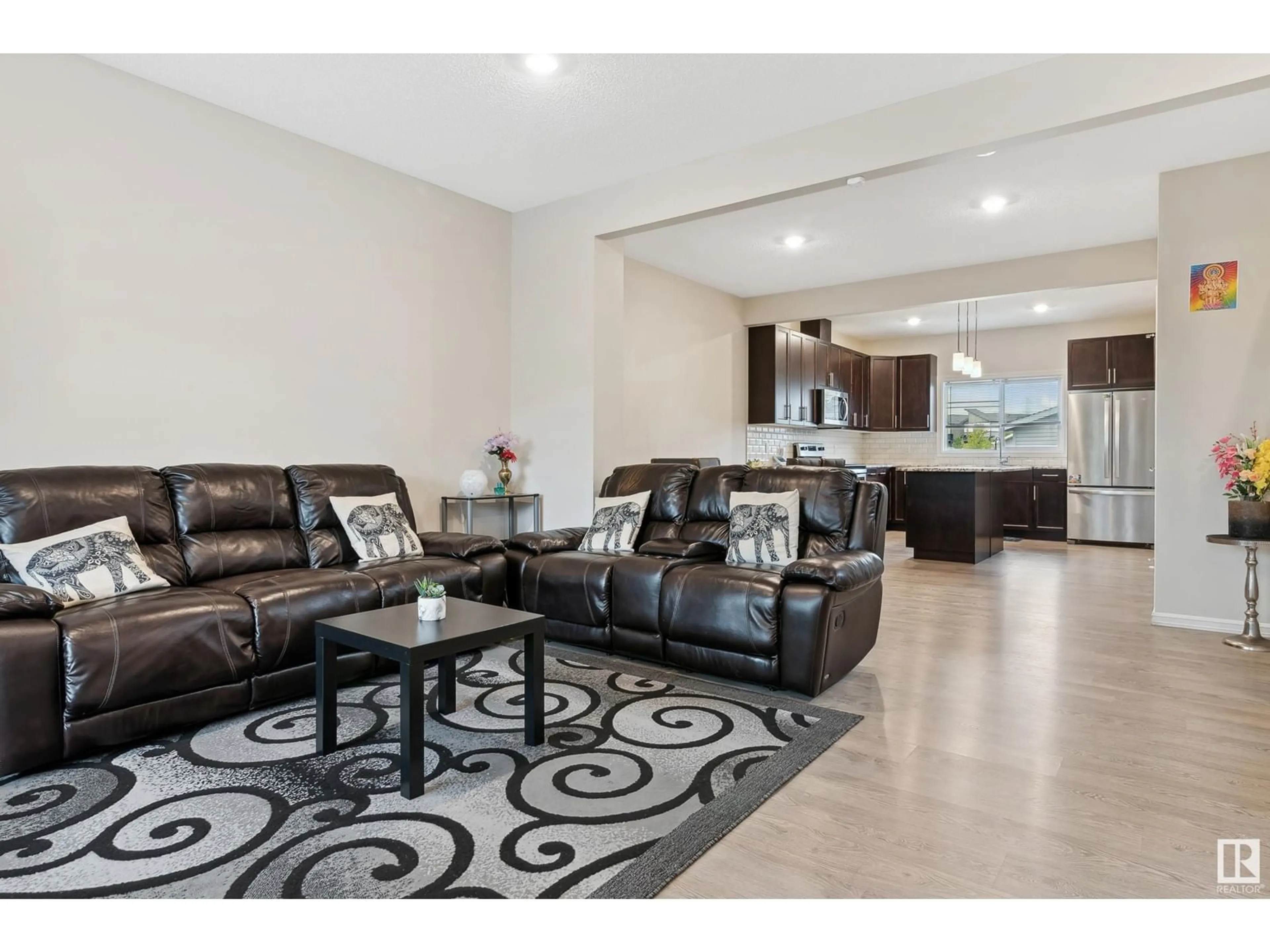 Living room with furniture, ceramic/tile floor for 2439 18 AV NW, Edmonton Alberta T6T2G7