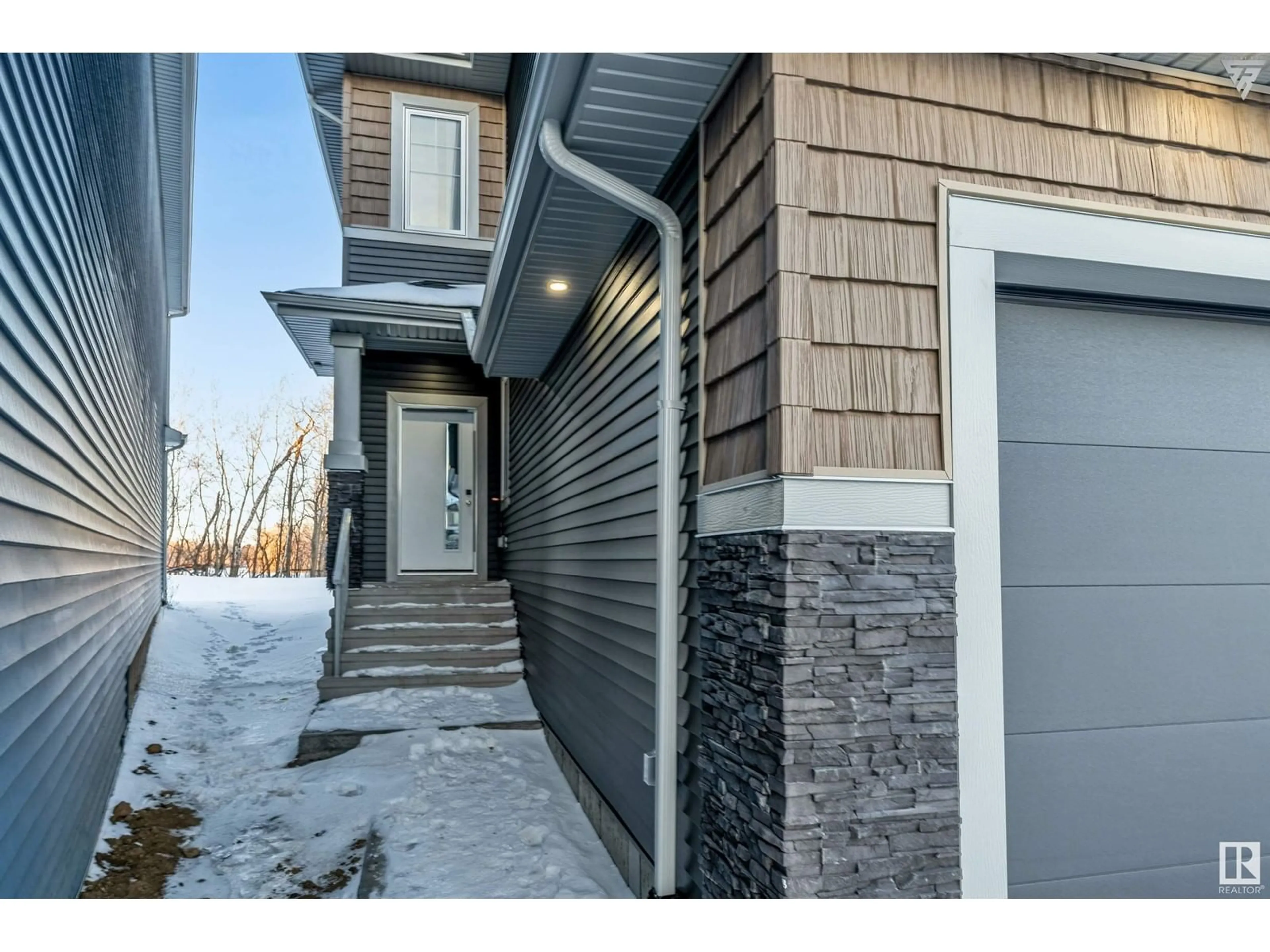 Home with brick exterior material, street for 8432 228 ST NW, Edmonton Alberta T5T4B4