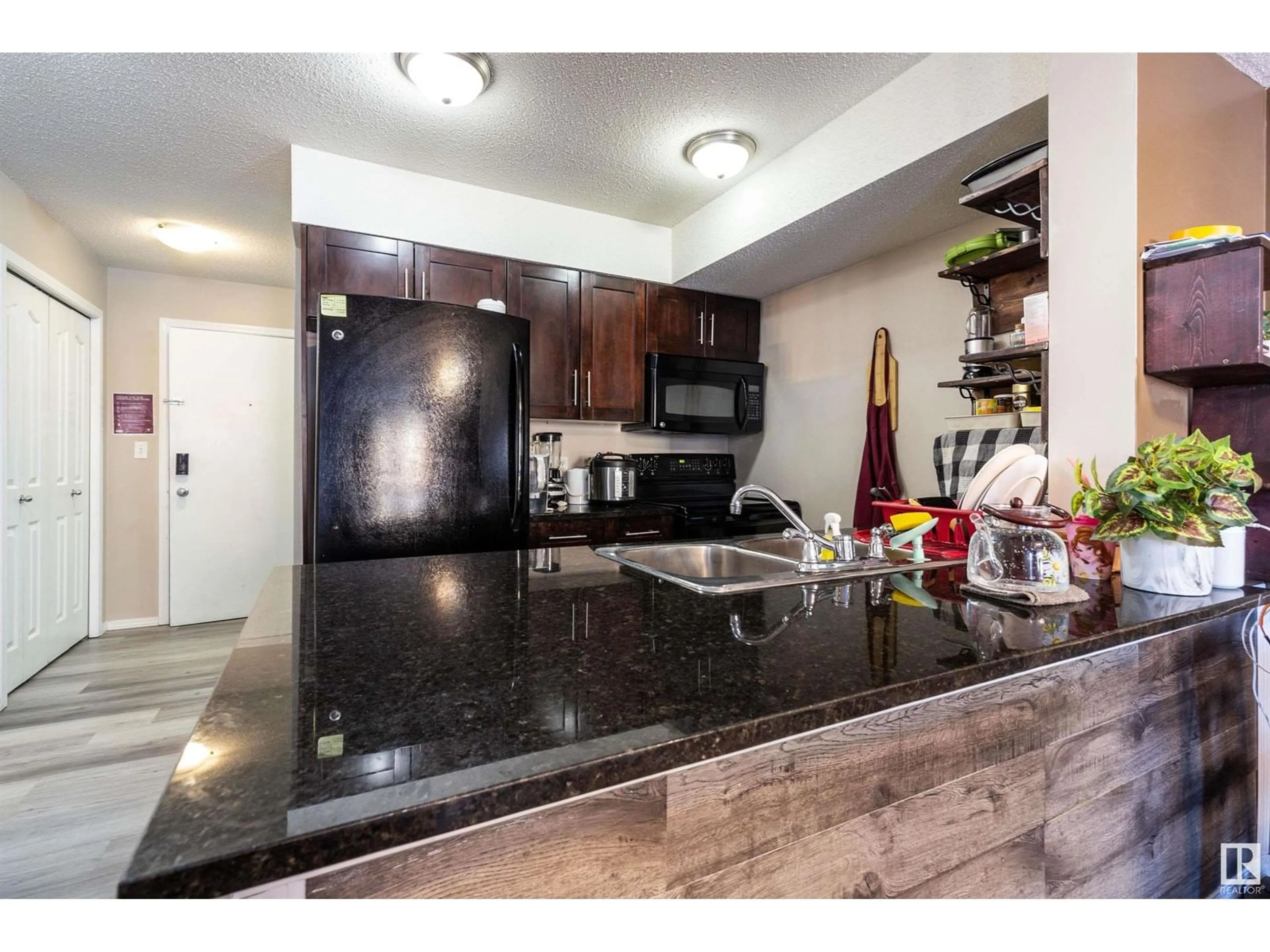 Open concept kitchen, unknown for #117 11804 22 AV SW, Edmonton Alberta T6W2A2