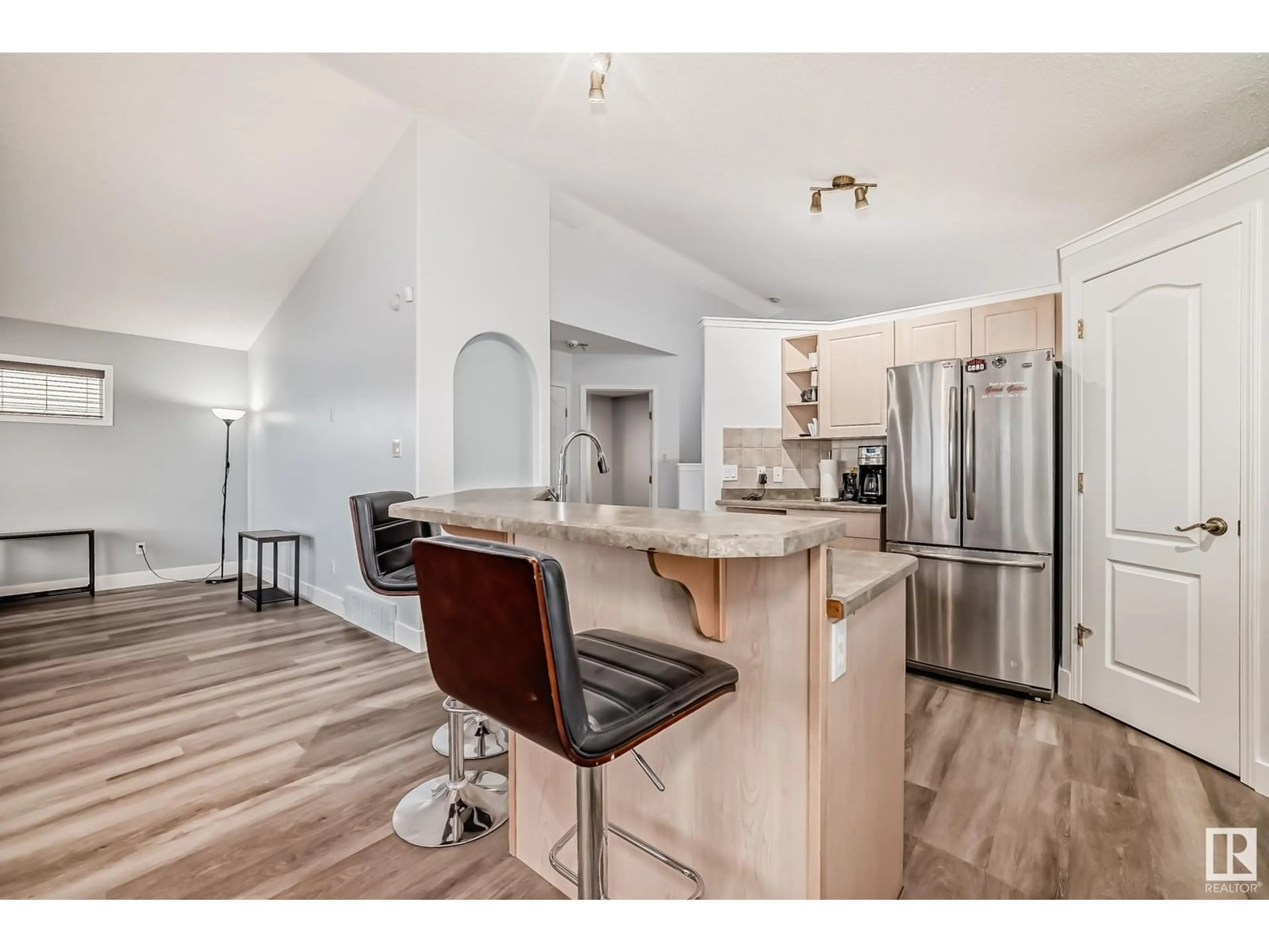 Open concept kitchen, wood/laminate floor for 89 HALDEN CR, Spruce Grove Alberta T7X2V7