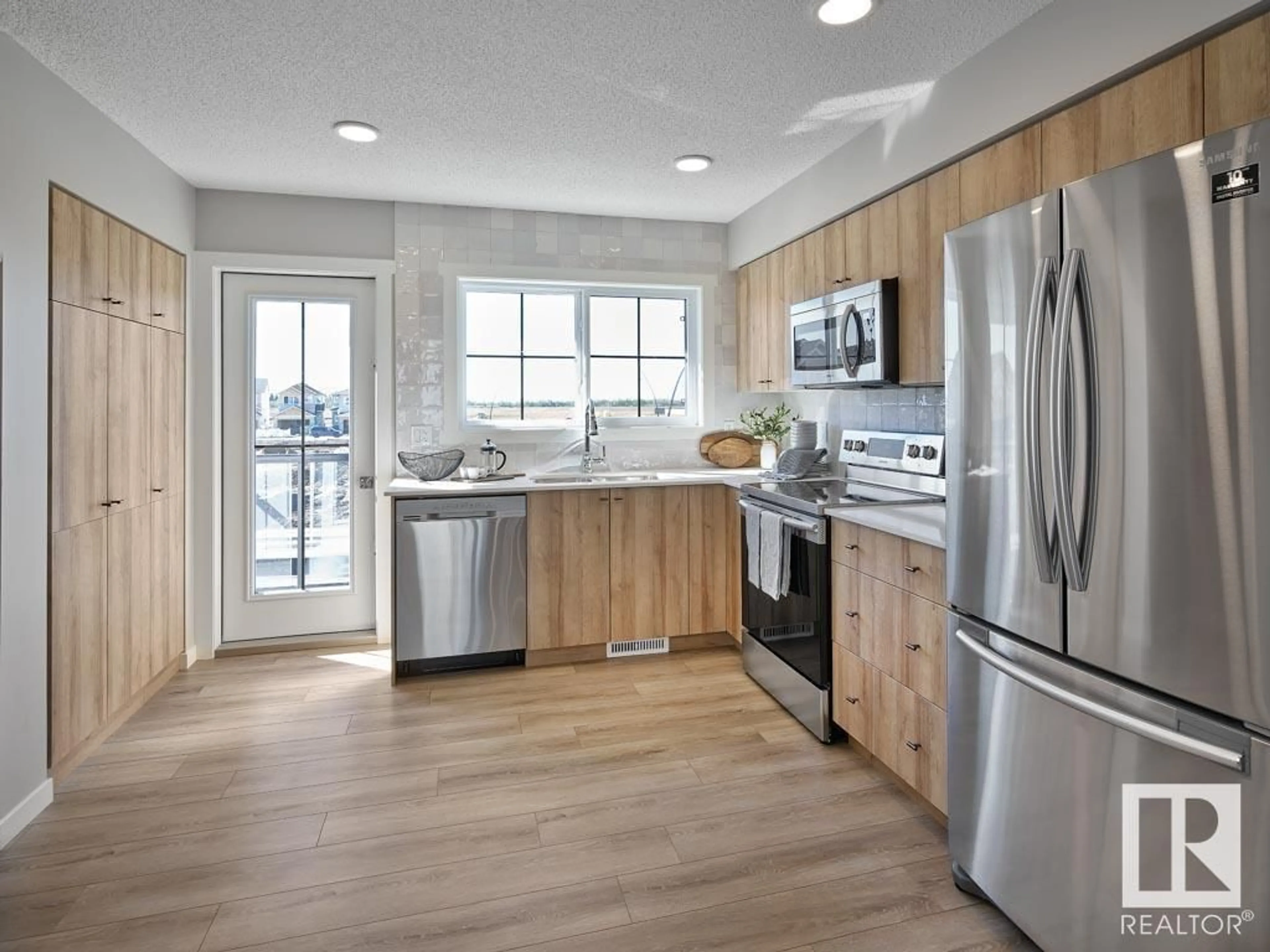 Open concept kitchen, wood/laminate floor for #19 29 Airport RD NW, Edmonton Alberta T5G2P9