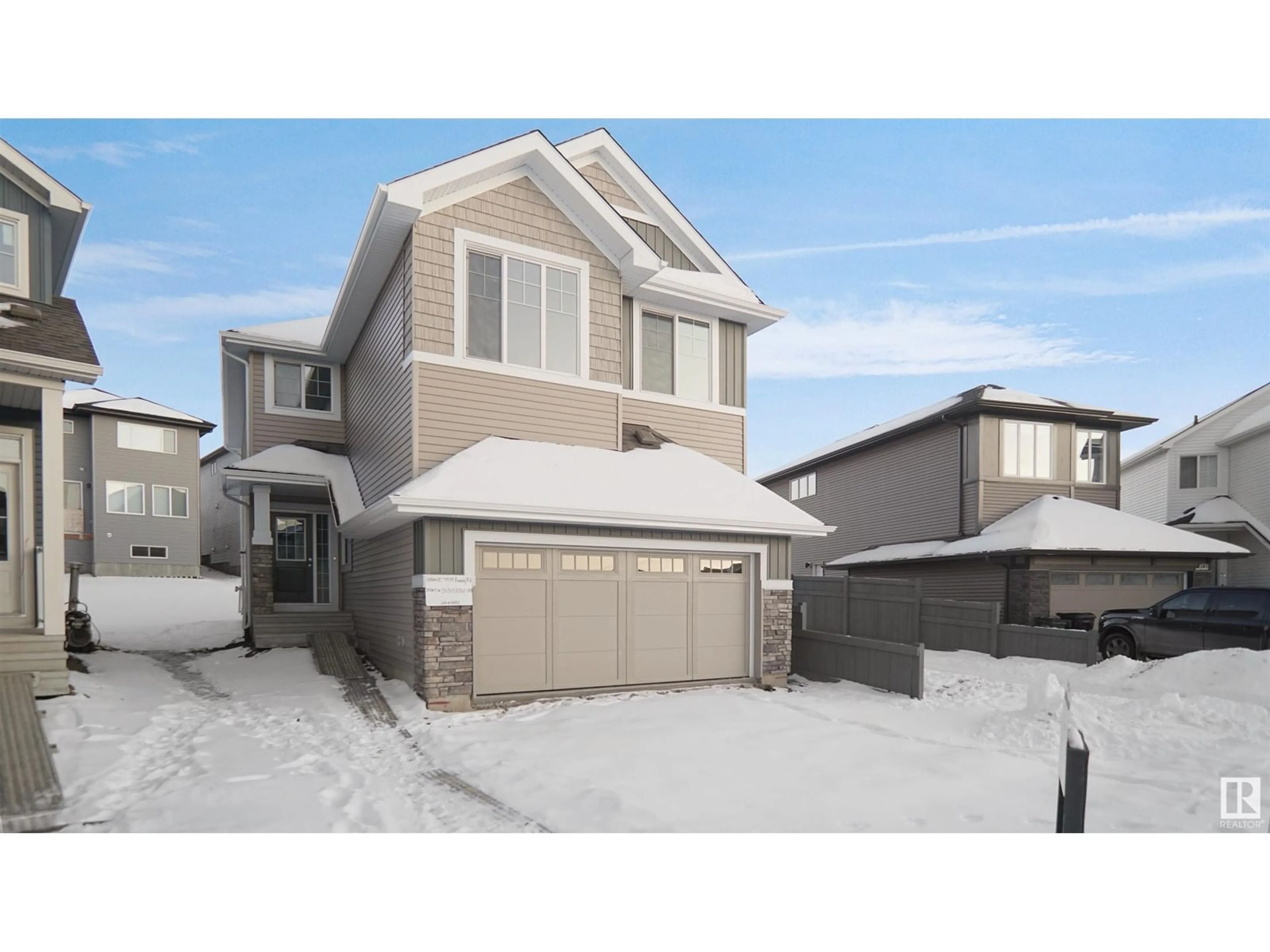 Home with vinyl exterior material, street for 4934 KINNEY RD SW, Edmonton Alberta T6W5H1