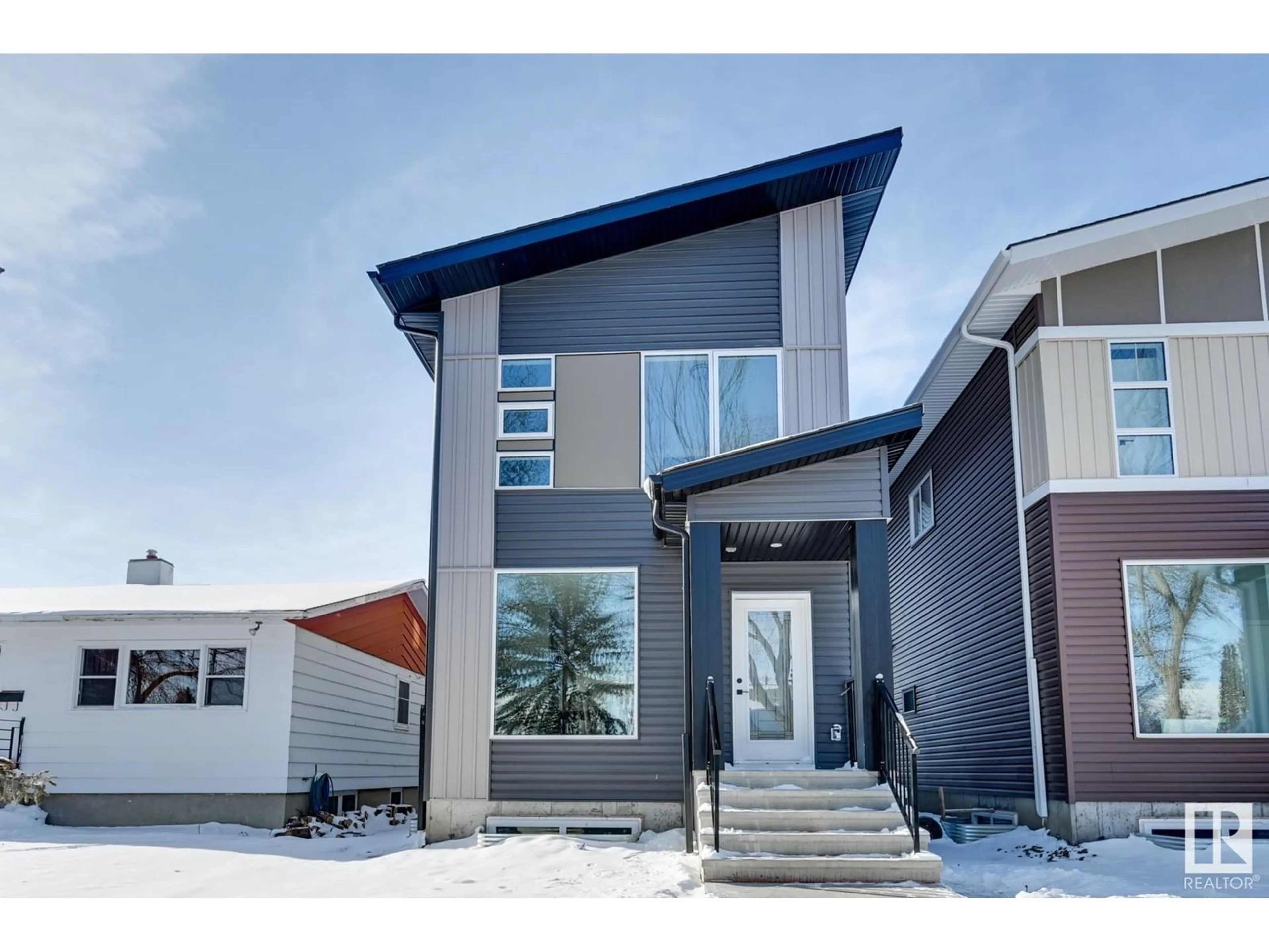 Home with vinyl exterior material, street for 11422 122 ST NW, Edmonton Alberta T5M0B9