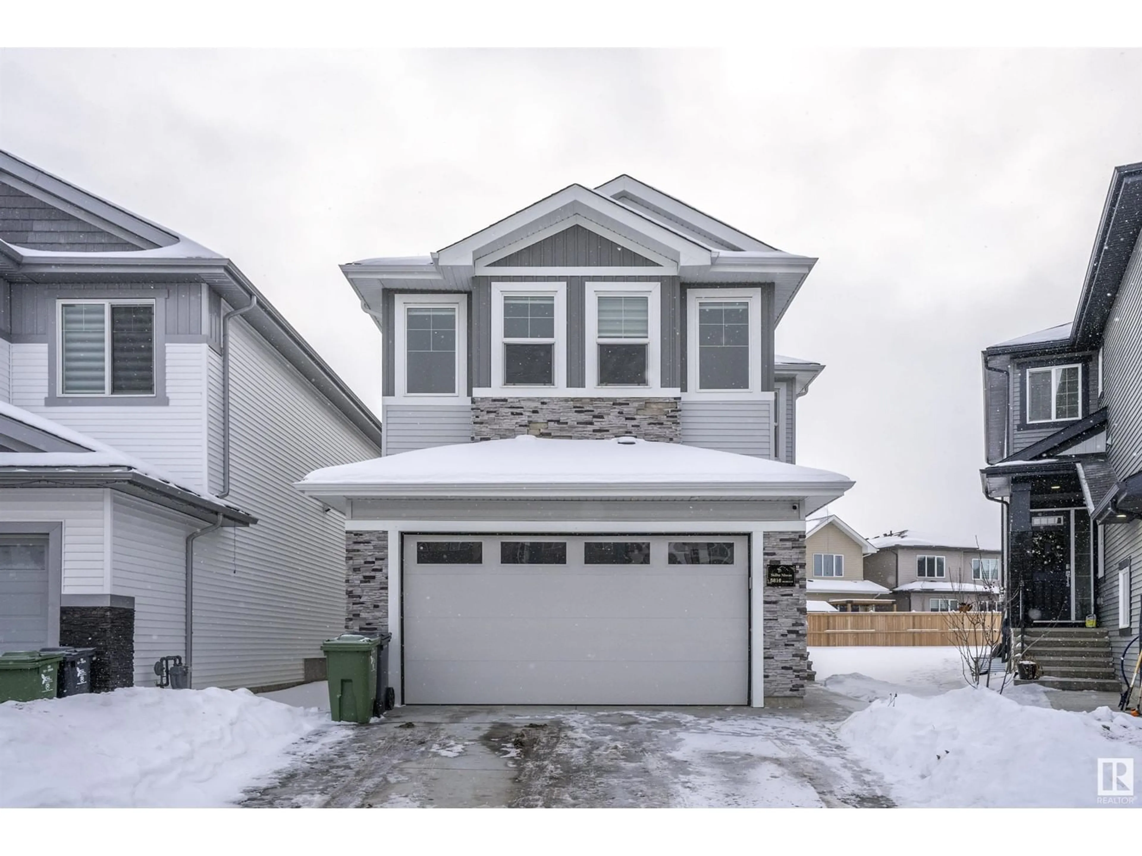 Home with vinyl exterior material, street for 5816 Peltier Close, Beaumont Alberta T4X2Y1